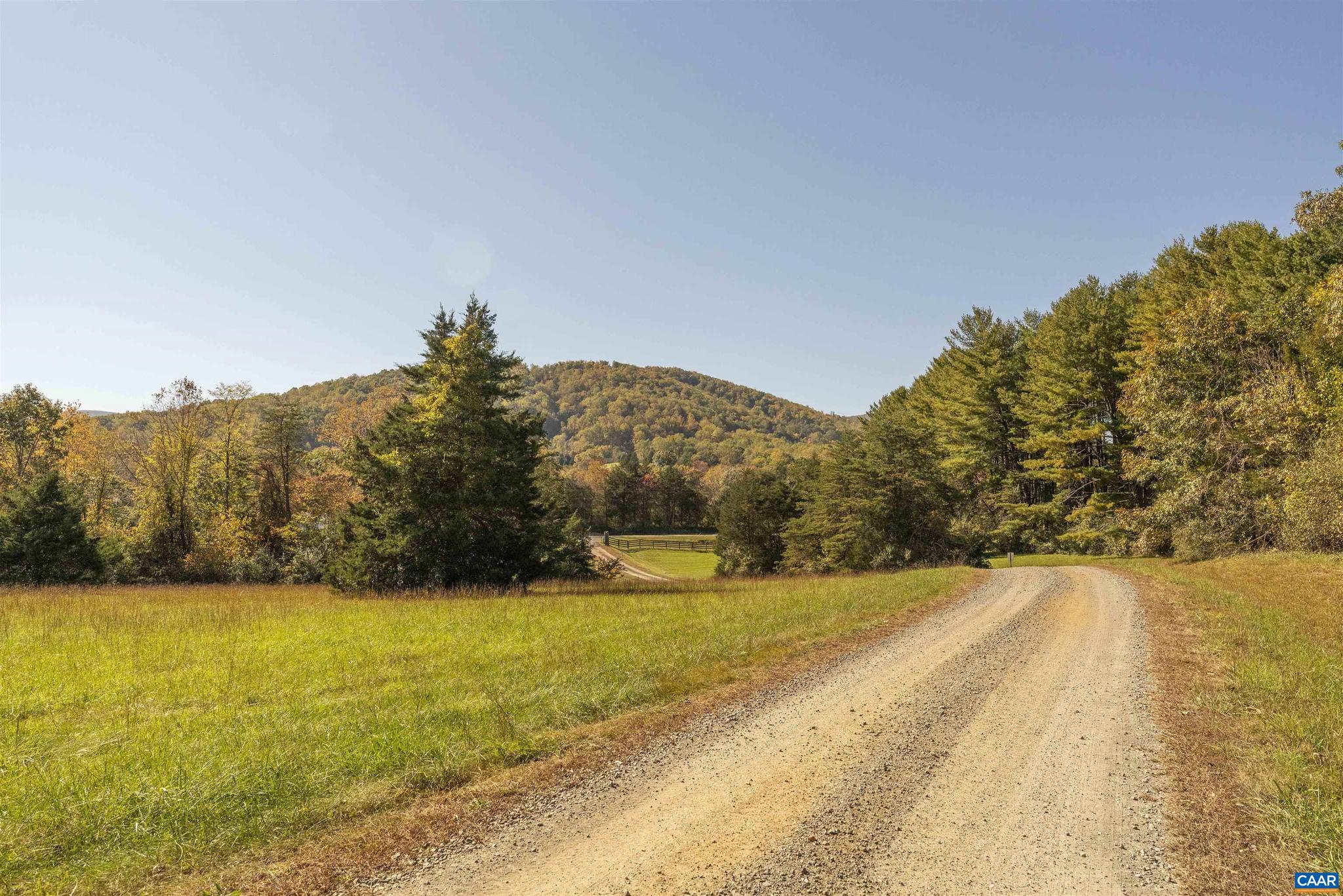A private collection of 8 homesites with a gated entrance offering privacy and year round mountain views in the heart of Nelson County's tourist corridor, Ennis Gap is a truly rare offering. Lot 7B features a mostly open homesite with a lovely tree buffer surround with great mountain views to the south and potential for amazing sunsets. You can also enjoy the North Fork of the Rockfish River via access easement to a community shared stretch of river. A perfect setting for a weekend retreat or a primary residence, do not miss this chance to build your dream home!