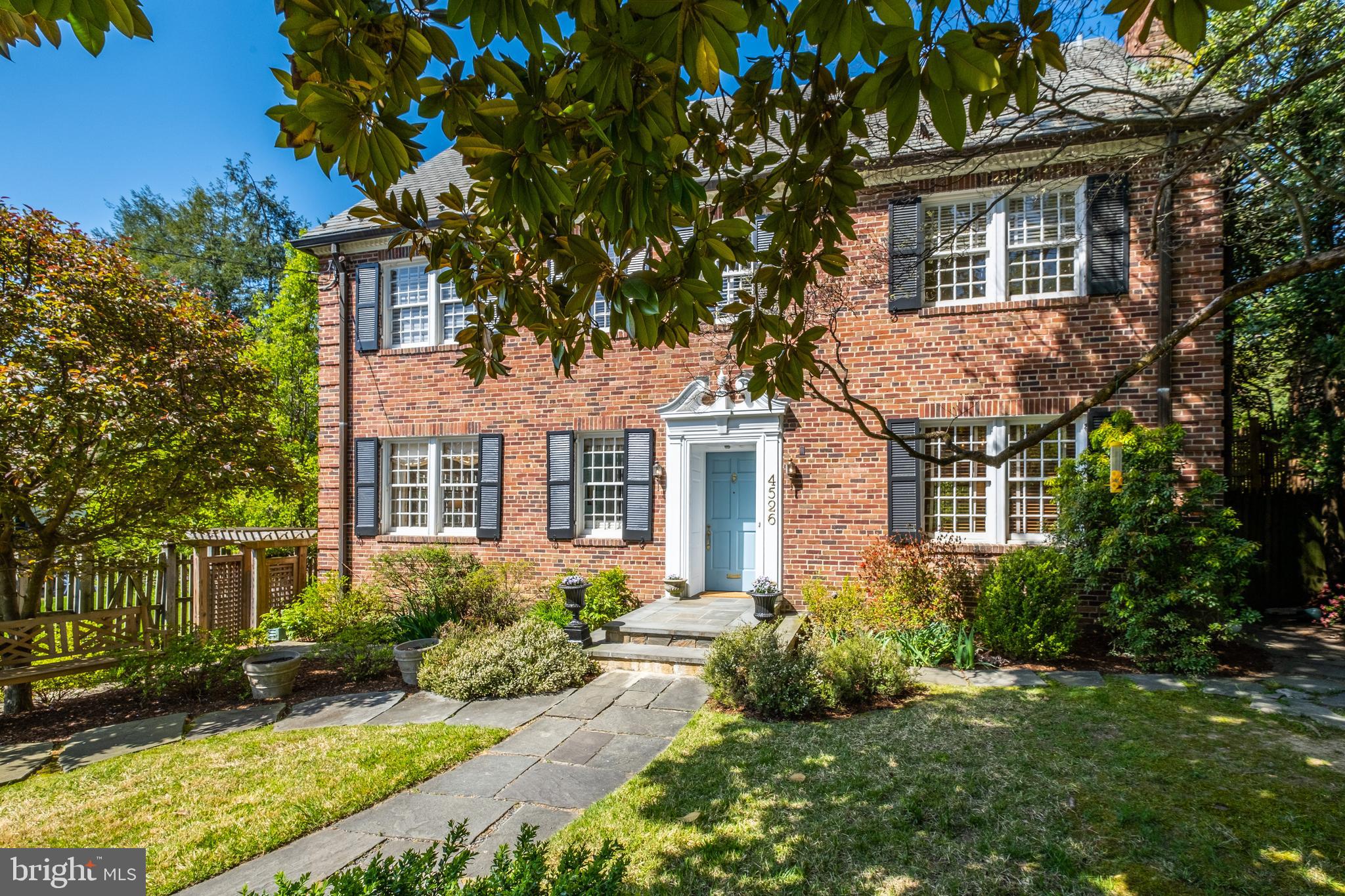 Gracious, brigh three level colonial offers 3,800 sf of living space with lush garden views on 11,700 sf level lot.  Vintage detail includes 12-over-12 sash windows, elegant marble foyer, distinctive curved staircase with ironwork railing, high ceilings, hardwood floors and three fireplaces.  Expansive living and dining rooms provide good entertainment flow to screened porch off rear, elevated deck.  Private library with pocket doors faces the kitchen -- renovated and expanded in 2009 with cherry cabinetry, granite counter tops, stainless steel appliances, breakfast island, wet bar and table space with bay window seat.  A spacious primary bedroom, three additional bedrooms and two baths comprise second level; two bedrooms, one bath and extra storage the third.  Laundry and powder rooms, storage, and yard access from original garage complete lower level.  Meticulously landscaped with off-street parking for 2-3 cars.  By Appointment.