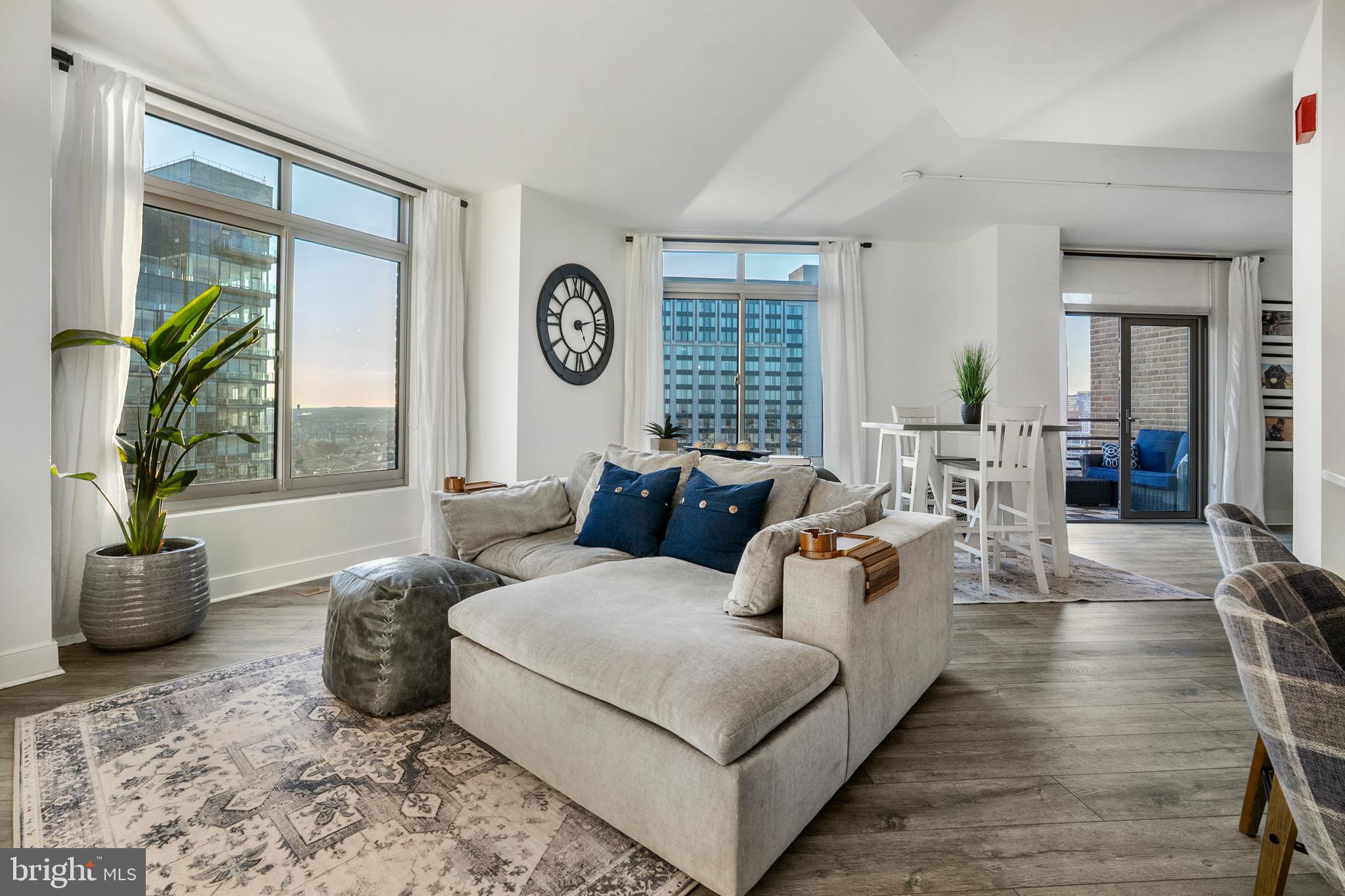 Sky-Level Luxury at The Vue | Harbor East

Commanding the 26th floor of The Vue, this extraordinary two-bedroom, two-bath sky residence offers a rare opportunity to own one of Harbor East’s coveted water-facing homes. Framed by expansive windows, the residence captures sweeping, unobstructed panoramas of Baltimore’s iconic skyline and shimmering waterfront—creating a constantly evolving backdrop of light, water, and city energy.

The home’s open, light-filled design blends modern sophistication with effortless livability. At its heart, the newer reimagined chef’s kitchen is both stunning and functional, anchored by an expansive quartz island and complemented by a refined subway tile backsplash, sculptural range hood, and integrated Microwave Drawer. This condo boasts new LVP flooring throughout. Whether hosting intimate gatherings or enjoying a quiet morning coffee, every detail has been thoughtfully curated.

Step onto the private balcony and experience Harbor East from above—where golden sunsets melt into city lights and the harbor reflects the rhythm of Baltimore below.

The primary suite is a serene sanctuary, offering new gorgeous plantation shutters, a walk-in closet and a completely-renovated spa-inspired bath designed for relaxation, complete with a glass-enclosed shower and elegant double vanity. A beautifully appointed guest suite with new remote-controlled blinds, its own custom walk-in closet and newly-renovated full bath provides comfort and privacy for visitors or serves as an ideal executive office.

One covered parking space conveys with the residence.

Life at The Vue offers a seamless blend of luxury, convenience, and security. Residents enjoy full-service amenities including front desk concierge, package acceptance, onsite management, and comprehensive building services. The monthly condominium fee includes heating, air conditioning, hot water, water, sewer, and building maintenance.

Private elevator access connects residents to the exclusive 8th-floor outdoor green space—an elevated urban retreat—as well as direct access to the MAC fitness center and Harbor East Cinemas. Just beyond your door awaits Harbor East’s premier collection of fine dining, boutique shopping, Whole Foods, waterfront promenades, and vibrant nightlife.

This is more than a residence. It is a vantage point above the city—and a lifestyle without compromise.