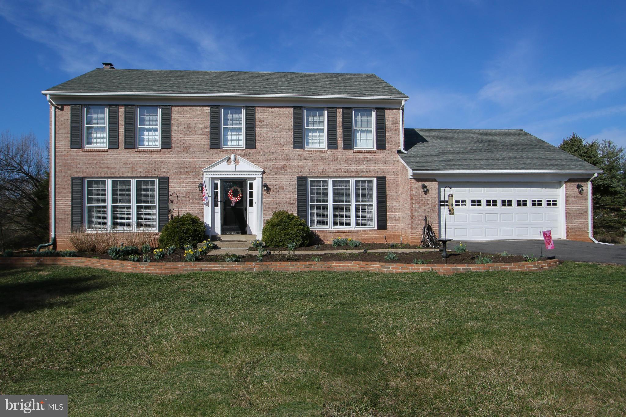 MOVE-IN READY BRICK FRONT COLONIAL*1.53 ACRES W/PANORAMIC VIEWS*2 CAR GAR*3500+ FIN SQ FT 3 LEVELS*5 BR/3.5 BA*HARDWOOD MAIN & UPPER LEVELS*10 CEILING FANS*UPDATED KIT W/GRANITE, ISLAND, & CERAMIC FLR*FAM RM OFF KIT W/BUILT-IN CABINETS & WOOD STOVE*UPDATED BATHS W/GRANITE *FIN WO DAYLIGHT BASEMENT W/NEW CARPET, REC RM, BR, DEN, BA, & WORKSHOP*LARGE DECK*BRICK PAVER PATIO*NEW ROOF*STORAGE*NO HOA