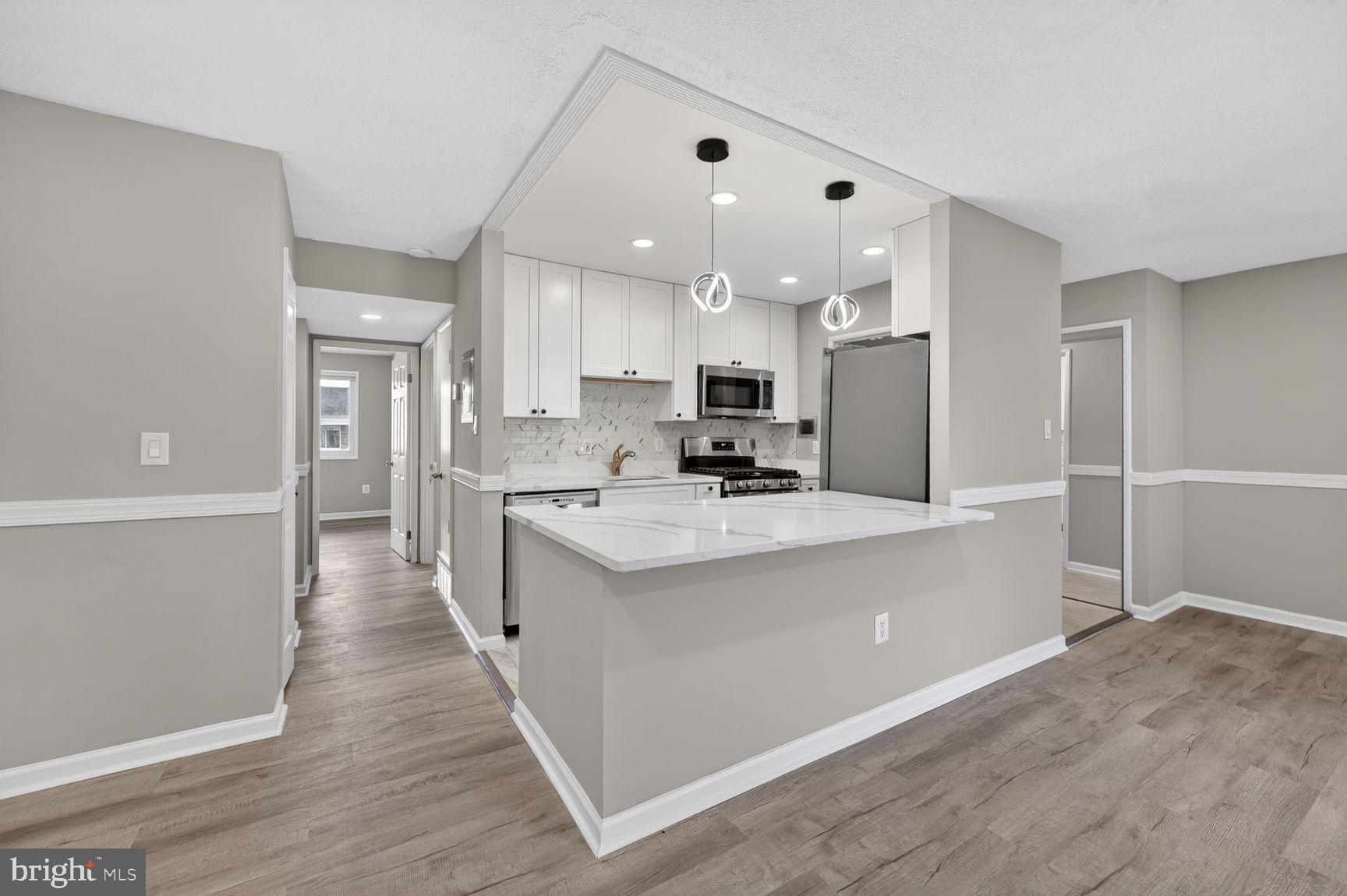JUST REDUCED! 5-DAY OFFER EVENT! Seller has made a significant price improvement and is inviting buyers to submit their highest and best offer  -- OPEN HOUSE SUNDAYS 10-12, RSVP REQUIRED BY SATURDAY!  BEAUTIFULLY RENOVATED TOP-FLOOR CONDOMINIUM located in the heart of Oxon Hill. This turnkey residence has been thoughtfully upgraded throughout, offering modern finishes, stylish design, and low-maintenance living at its finest.  Step inside to discover a fully updated interior, featuring brand-new flooring, a redesigned kitchen with contemporary cabinetry, sleek countertops, and updated appliances. The bathrooms have been completely remodeled with modern fixtures and finishes, creating a clean, sophisticated feel.  Every detail has been refreshed—from lighting and fixtures to paint and finishes—making this home truly move-in ready.  Perfectly situated just minutes from National Harbor, this location offers unmatched convenience and lifestyle. Enjoy easy access to shopping and dining at Tanger Outlets National Harbor, entertainment at the waterfront, and nearby parks and recreation.  Commuters will appreciate quick access to major routes including I-495, I-295, and convenient connections into Washington, DC and Northern Virginia.  INVESTORS WELCOMED.  Whether you're a first-time buyer, downsizing, or looking for an excellent investment opportunity, this fully renovated condo delivers on style, comfort, and location.  Don’t miss your opportunity to own a like-new home in one of Prince George’s County’s most convenient and rapidly growing areas.  RSVP REQUIRED BY SATURDAY FOR OPEN HOUSE OR CONTACT AGENT FOR PRIVATE TOUR OF THIS BEAUTIFUL CONDO TODAY!