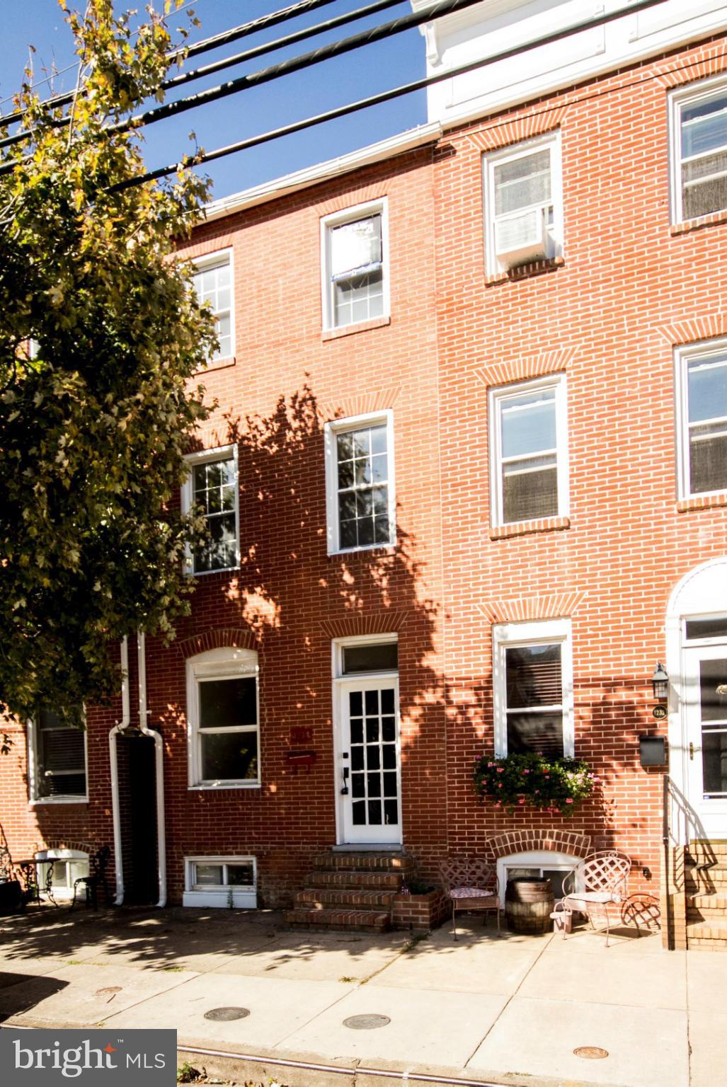 Wonderful opportunity to own this beautiful all brick gem in Locust Point. Enjoy nice room sizes, new appliances, wood floors, fresh paint, eat in kitchen, and even off street PARKING PAD  Use the basement for bonus living space or even a 4th bedroom. Reap the benefits of all the amenities the Locust Point has to offer!  Just a few minute drive from Downtown Baltimore or take the water taxi!