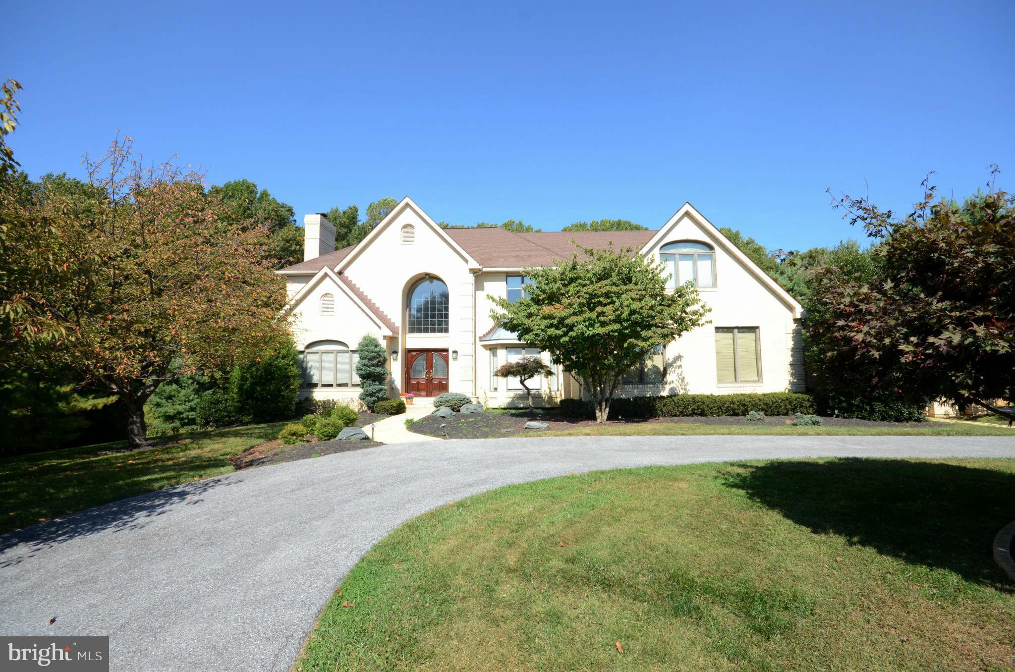 This sun-filled 4BR 4.5 BA Contemporary offers great gathering spaces with over 6500 sq feet of living space. Situated on a serene  1.3 acre beautifully landscaped lot, this home boasts a new Gourmet Kitchen, first floor study, Huge MBR w/sitting area and fantastic fully finished LLVL with Rec Room, Full Bath and poss 5th BR! . Enjoy wooded vista from expansive deck overlooking in-ground pool.