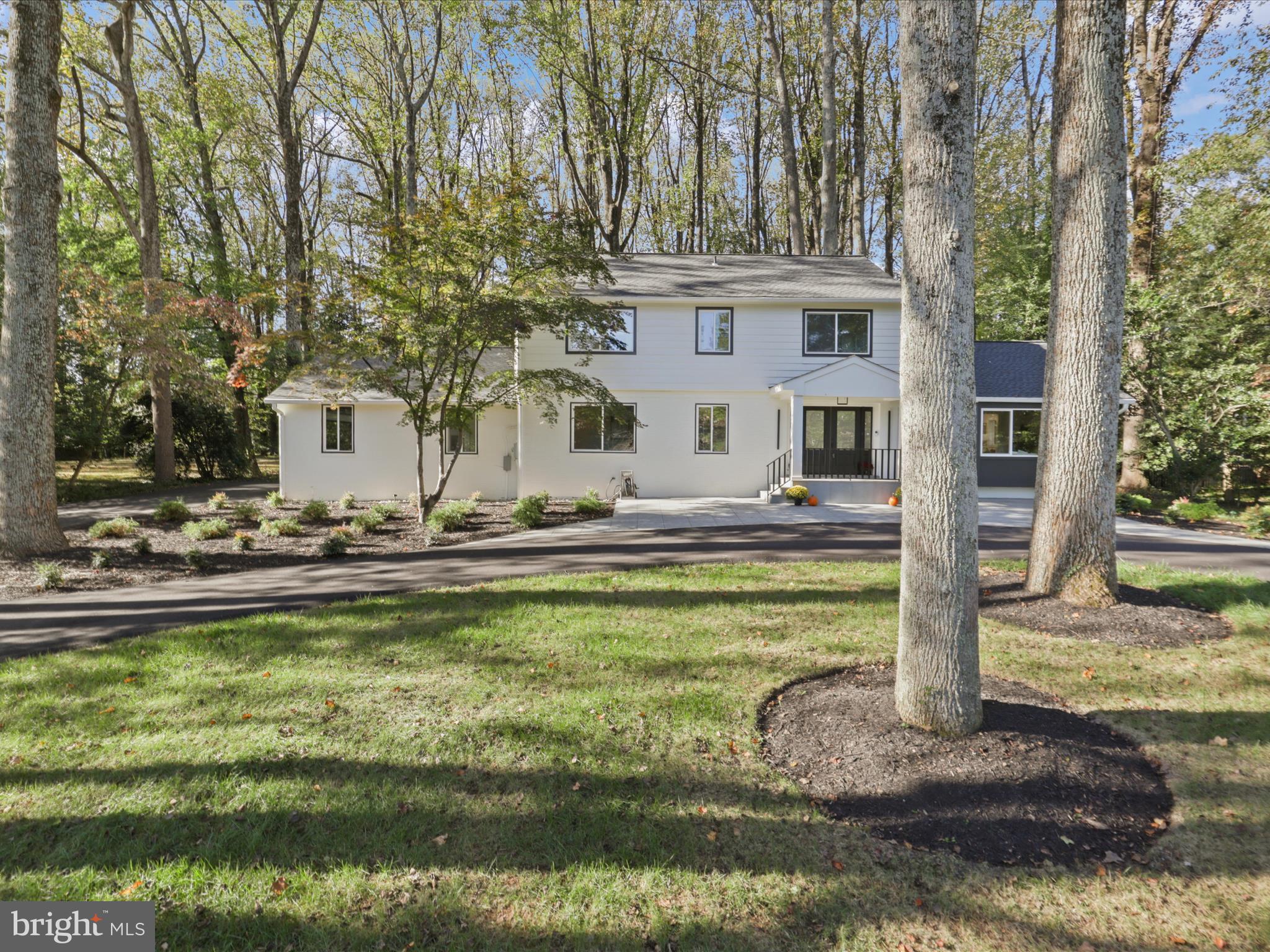 NOW OFFERED AT $2,635,000
Appraised at $2,700,000 – Exceptional Value in McLean Luxury Living

Experience the perfect blend of timeless elegance, modern design, and exceptional craftsmanship in this fully renovated luxury residence offering 4,566 square feet of beautifully curated living space on a private 1.2-acre lot.

Every inch of this remarkable home has been thoughtfully reimagined with premium finishes, sophisticated design elements, and high-quality upgrades, creating a truly turnkey living experience.

Exceptional Interior Features
Stunning gourmet kitchen featuring custom German cabinetry, a dramatic Calacatta quartz island, and premium GE, Bosch, and LG appliances
Open-concept floor plan designed for today's lifestyle and entertaining
Luxurious porcelain and hardwood flooring throughout
Designer lighting and recessed lighting package
Fully updated HVAC, electrical, and plumbing systems
Spa-inspired bathrooms with premium tilework and frameless glass shower enclosures
Custom walk-in closets, including a cedar-lined closet
EV charging station in the oversized two-car garage
Impressive Exterior Improvements
New architectural roof and premium gutter system
Energy-efficient JELD-WEN windows and doors
Fresh exterior paint with refined trim detailing
Professionally landscaped grounds with ambient lighting
Circular asphalt driveway and renovated garage
State-of-the-art septic system
Expansive patio with designer lighting and Ring video security system

Main Level

Sun-filled living spaces showcase breathtaking views of the surrounding natural landscape from nearly every room. Elegant living and dining areas flow seamlessly into the spacious eat-in kitchen and adjoining family room. Large glass doors open to an expansive patio and screened porch, creating the ideal setting for indoor-outdoor entertaining.

A main-level bedroom with a full bath provides the perfect guest suite, home office, or multigenerational living option.

Upper Level

The upper level offers three spacious bedrooms, including a luxurious primary suite featuring abundant natural light, a custom walk-in closet, generous dressing area, and a beautifully renovated spa-like bath. Two additional bedrooms share a stylishly updated full bathroom.

Lower Level

The versatile lower level includes a fifth bedroom (NTC) with direct outdoor access, a cedar closet, walk-in closet, and full bath—ideal for guests, an au pair suite, or a private home office. A large unfinished area provides endless possibilities for customization, whether envisioned as a media room, fitness studio, recreation room, or additional living space.

A Rare Opportunity

This exceptional residence combines luxury, privacy, modern convenience, and outstanding value. With an appraisal of $2,700,000 and an offering price of $2,635,000, this is a rare opportunity to own a fully renovated, move-in-ready luxury home in one of McLean's most desirable settings.

Floor plans for all levels are available in the photo gallery.