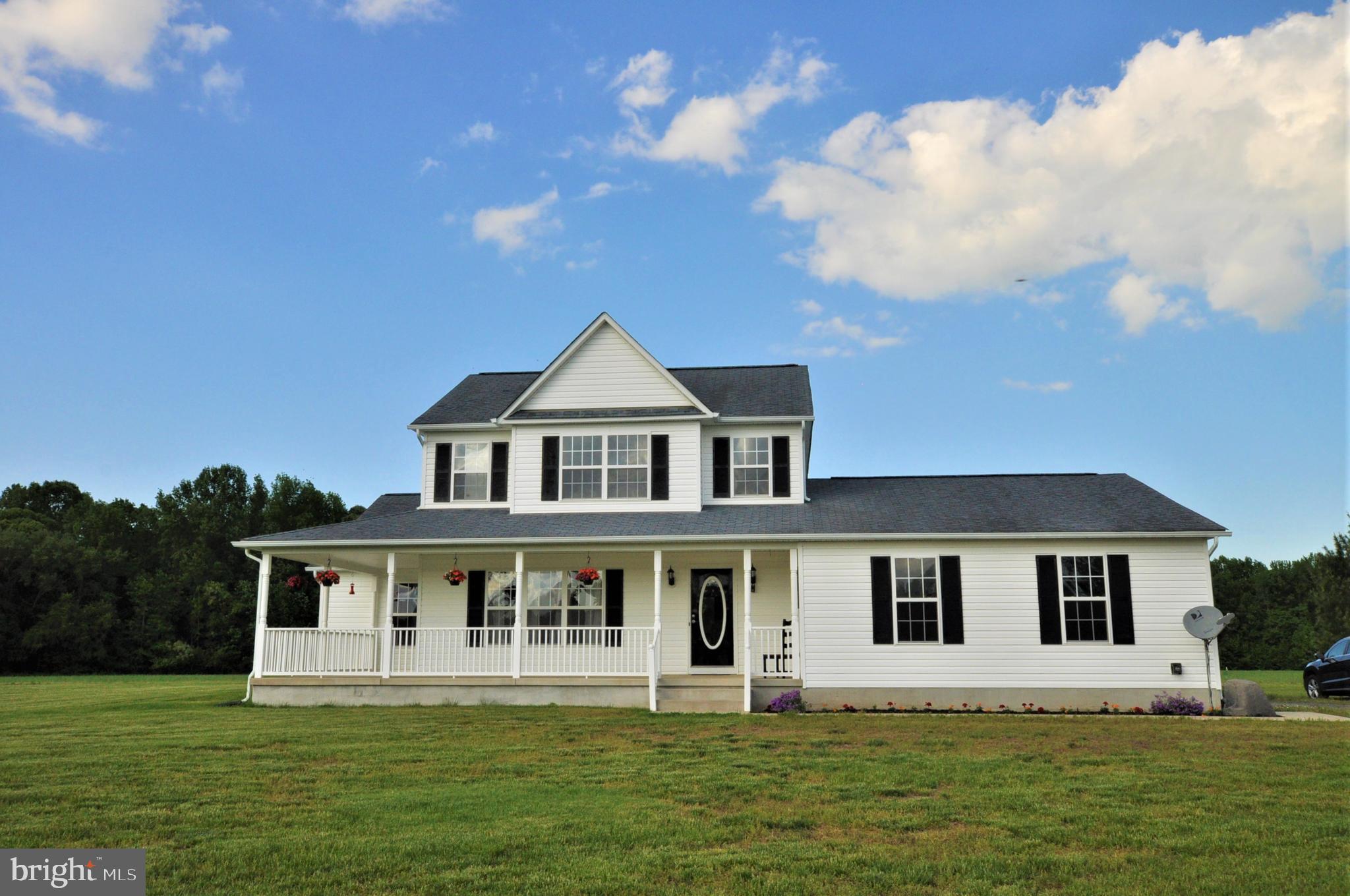 COUNTRY LIVING, YET CLOSE COMMUTE!! Very private property in a beautiful setting   come live here and enjoy peace and serenity as you sit on your wrap around front porch and relax. Beautiful 4 bedroom, 2.5 bath home on almost 6 acres in great location is ready for you to just move right in!  Nice kitchen with Corian countertops and most appliance are brand new. There is also new carpeting and paint throughout much of the home, Huge oversized 2 car garage with big storage room/workshop area is great for those who like to tinker! First floor master suite and 3 generous sized bedrooms upstairs   all with walk in closets complete this great place to live! The property is beautiful, level land   great for farming crops or bring your horses.  Property is in a beautiful area for horses! This property affords you the opportunity to live in the country, yet close enough to easily commute to Washington, D.C., Joint Base Andrews and even an easy distance to beaches!  Come take a look!