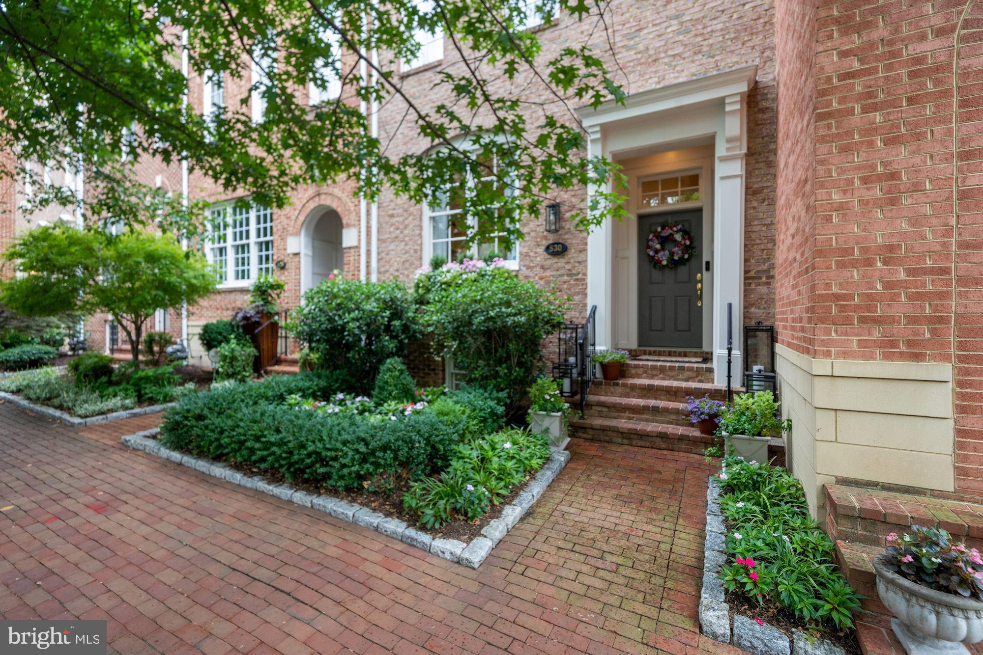 Old Town living rarely offers the space, convenience and luxury of this exquisite 4-level townhouse, which has been recently refined and is presented in immaculate condition. With over 3000 square feet, 4 bedrooms, 4.5 bathrooms, a 2-car garage plus a charming courtyard, there’s plenty of room for families and guests. The main level has an open dining room, living room, and gourmet kitchen with a large island, Bosch appliances, soft-close drawers, a circular pantry and stunning quartzite counters. The family room’s centerpiece is an electric fireplace with switchable heat and flame functions. For outdoor dining and entertaining, there is a private, brick-walled courtyard, complete with a built-in, multi-function Alfresco gas grill.  
The second level features a luxurious Owner’s Suite with two walk-in closets and coffered ceiling. The adjoining bathroom has double vanities, a large glass walk-in shower with multiple heads, back-lit and anti-fog mirrors, and marble floors. Completing this level are a laundry room and a dedicated office/den with views of trees and Pitt Street.  
On the top floor you’ll find a tranquil sitting area/library with custom built-ins. This space is flanked by 2 bedrooms, each with ensuite bathrooms. The lower level includes a bautifull finished large second family  room with gas fireplace, bedroom, full bathroom and a sizable walk-in storage space. 
Among the many unexpected features is a 2-car garage, rare for Old Town, fitted with Garage Living custom cabinets and Floortex epoxy flooring. The front landscaping was designed by Greenstreet Gardens and includes an automated irrigation system. The townhouse is located just two blocks from Harris Teeter and Trader Joe’s, a 5-block stroll to the shops and restaurants of King Street or Old Town North, and easy access to Metro, the GW Parkway and Reagan airport. Rarely do you find this combination of size, features and Old Town location at this price.