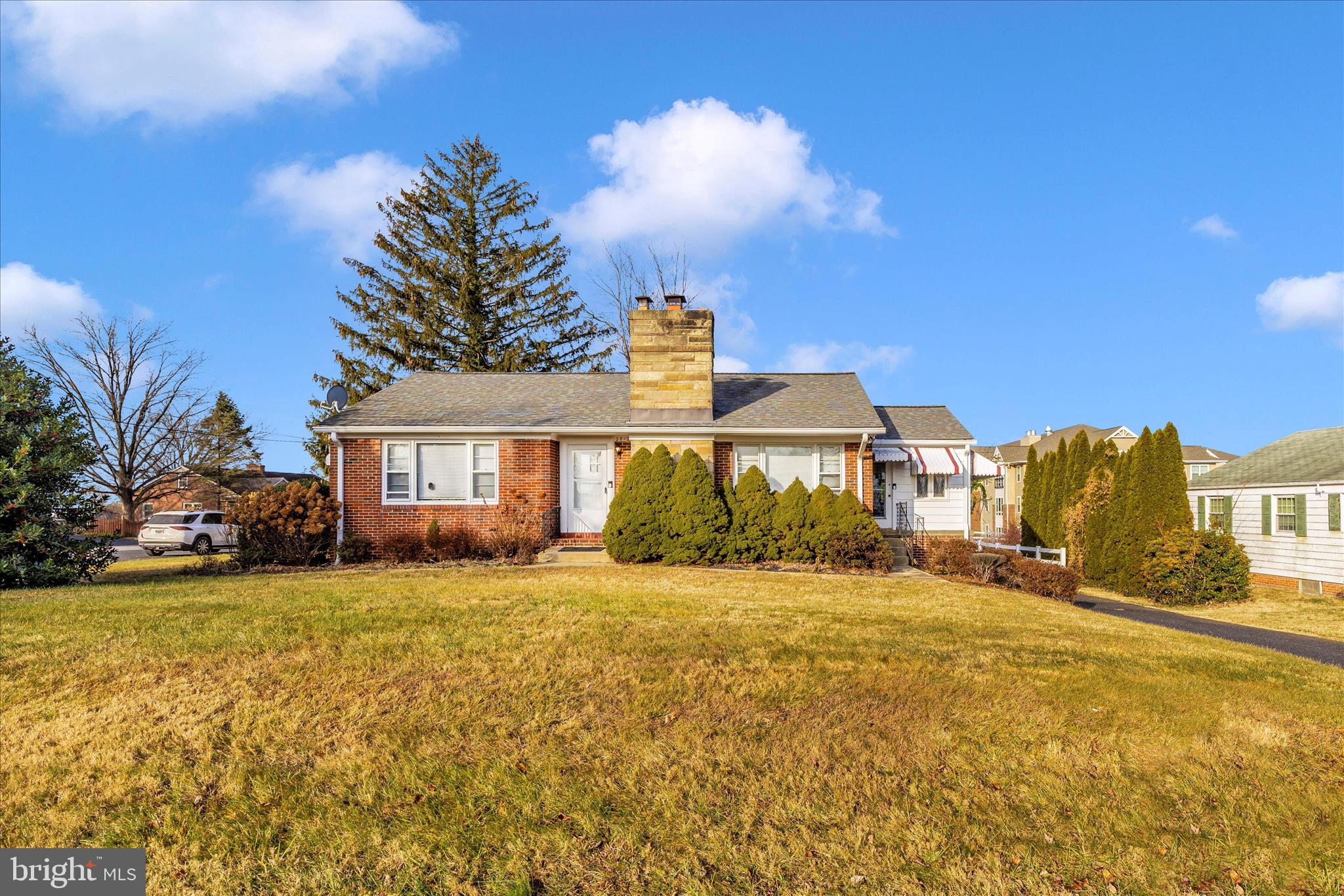 This well-maintained brick rambler offers flexible living spaces, classic details, and a layout designed for everyday comfort. Inside, hardwood floors flow through a spacious living room, a bright kitchen with a breakfast room and built-in cabinetry, two generously sized bedrooms with built-in storage, and a full bath on the main level. A large sunroom with a separate entrance and a fully finished lower level featuring a second kitchen, full bath, laundry, two large dens with closets, and a wood-burning fireplace create ideal space for guests or multi-generational living. Off-street parking for three cars and a one-car garage add everyday convenience while keeping the focus on the home’s charm.  Ideally situated in the heart of Damascus, this home offers easy access to nearby shops, dining, and everyday conveniences. You won't want to miss out!