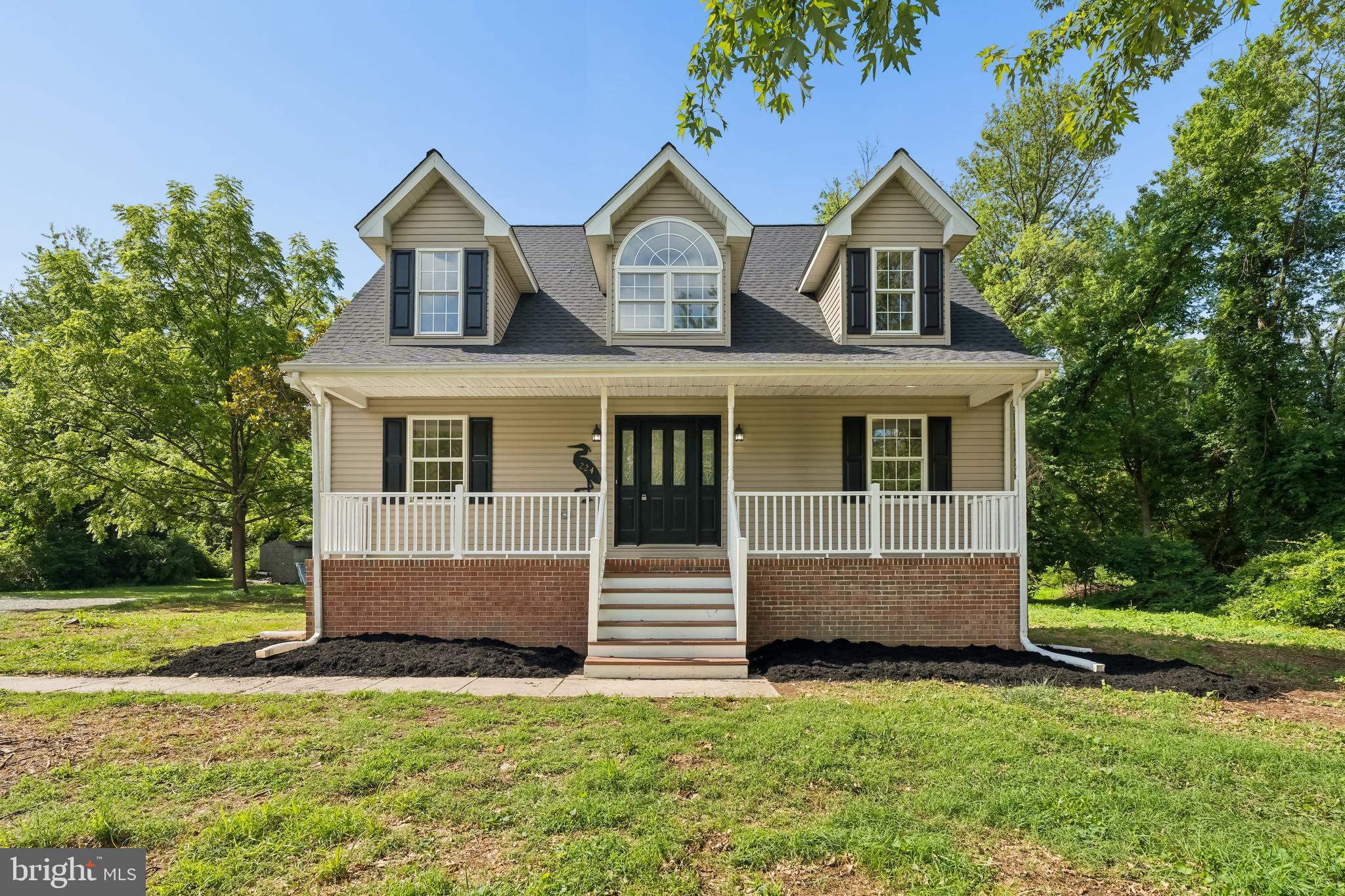 Welcome to this beautifully renovated Cape Cod, perfectly situated in the heart of the charming, water-oriented town of North East. Thoughtfully updated from top to bottom, this move-in-ready home offers the perfect blend of modern finishes and timeless appeal.

The main level features a desirable first-floor primary suite complete with a private full bath offering dual vanities and a spacious walk-in shower, along with the convenience of main-level laundry. A welcoming half bath is located just off the entry for guests. The bright and inviting floor plan also includes a spacious living room, formal dining room, and an eat-in kitchen showcasing new cabinetry, quartz countertops, and ample space for everyday dining and entertaining.

Luxury vinyl plank flooring extends throughout the home, creating a cohesive and low-maintenance living space. Upstairs, you'll find three generously sized bedrooms and a full hall bath with a tub/shower combination, providing plenty of room for family, guests, or a home office.

Recent improvements include a new roof, new HVAC system, freshly renovated deck, and a newly paved driveway with a convenient turnaround, offering peace of mind for years to come.

Located just minutes from North East's vibrant downtown, marinas, waterfront parks, restaurants, and shopping, this beautifully updated home offers the opportunity to enjoy small-town charm with easy access to the Chesapeake Bay.
