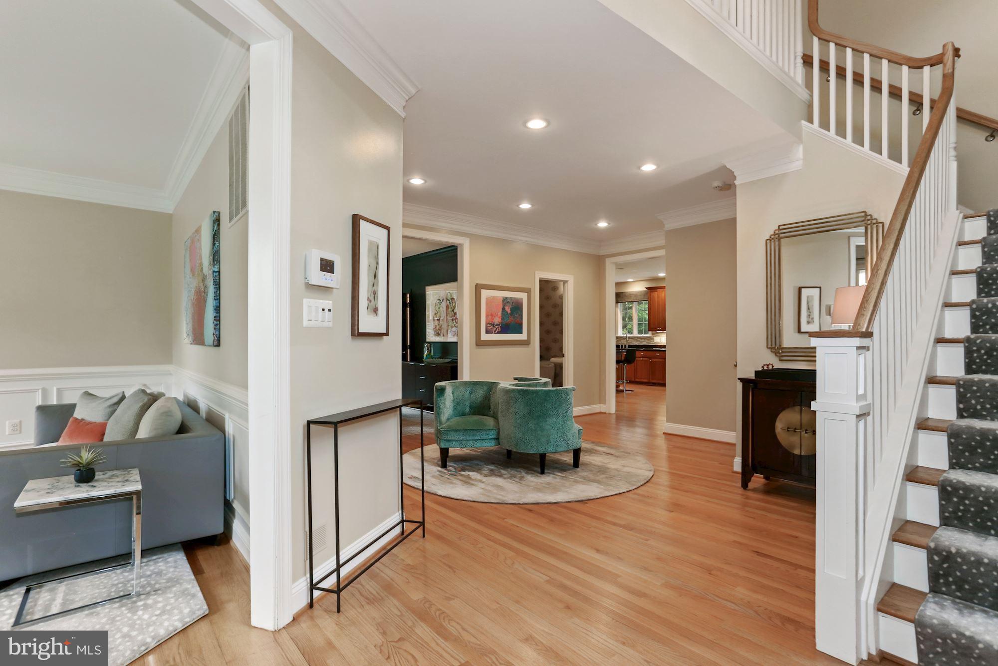 Open Sun 6/27 2p - 4p! Beautifully updated and maintained 6BR/4.5BA in sought after Country Club Hills. Main level features a spacious foyer that flows to a formal living room, private at home office, stunning dining room, gourmet kitchen with granite counters and stainless steel appliances and a light-filled family room with built-in book cases, a gas fireplace and opens to a private, flat backyard. Upper level features a stunning Master bedroom with two walk-in closets and updated, spa-like bathroom, guest room en suite, two additional bedrooms, an updated hall bathroom and spacious laundry room. The lower level has a two car garage that opens to a mud room, large recreational room, exercise/bedroom, additional bedroom, full bathroom and lots of storage. **Tax records do not reflect that total sq footage is 5,186**