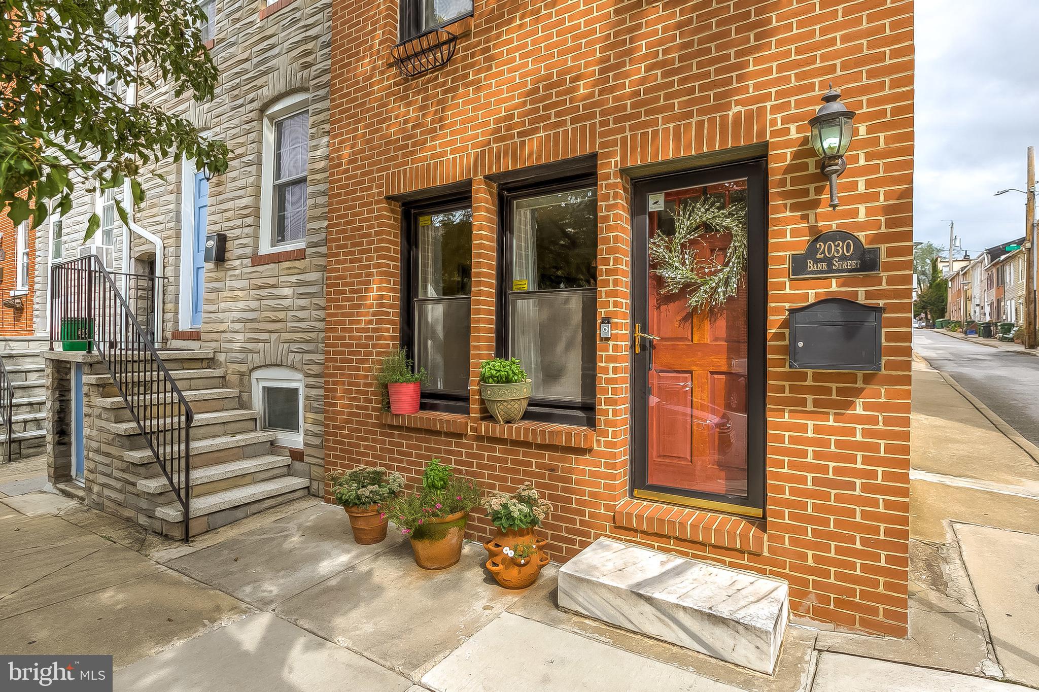 Incredible fells point end unit with garage parking and rooftop deck!   This home has been immaculately maintained and the pride of ownership is obvious.   This beautiful 3 story all brick end unit boasts all the modern amenities that city dwellers LOVE.   Updated kitchen with high end appliances.  3 large bedrooms and 2 luxurious full bathrooms.   Newly installed all composite rooftop deck with sweeping city views.   Off street parking in your side entry garage / parking pad.  Bone Dry basement with ample storage.    Freshly painted exterior brick. New front windows.  Location. Location. Location!