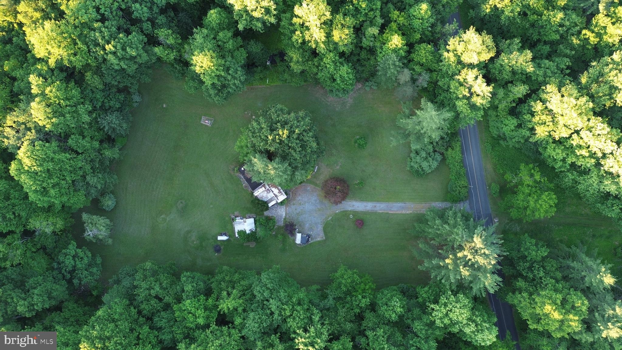 Private 2.6-acre creekside property with approximately 388 feet along Lower Little Swatara Creek. The level, mostly open parcel is surrounded by mature trees and offers exceptional privacy with existing infrastructure and several outbuildings. An older mobile home/trailer currently exists on the property but is considered to have little or no contributory value. Located within a flood zone. Cash sale only, as-is. Ideal opportunity for recreational use, a weekend retreat, or buyers seeking a private setting with existing infrastructure already in place. See our drone tour or schedule your showing today!