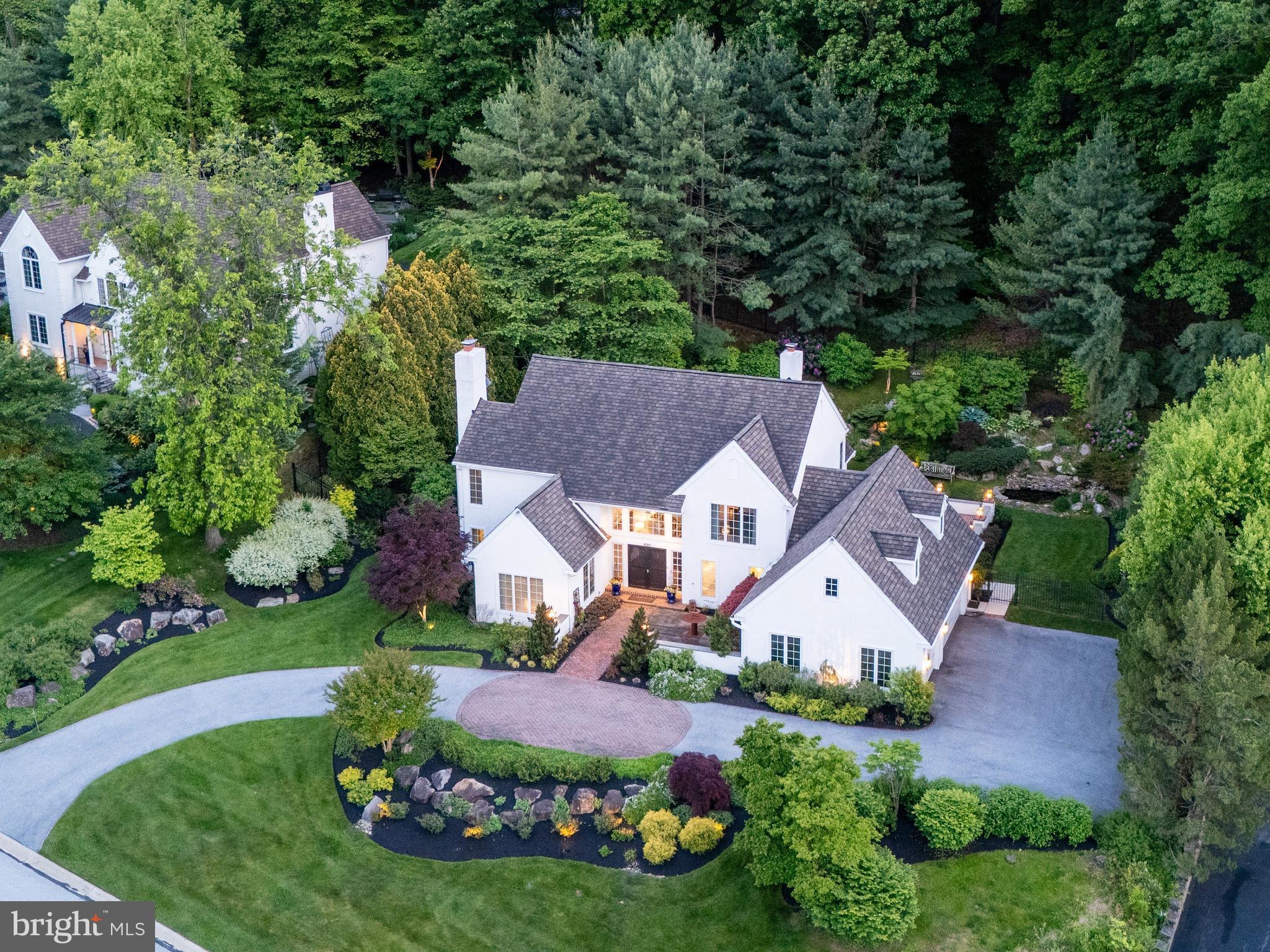 Welcome to 430 Freedom View Lane, a beautifully updated French Country residence designed by renowned architect Ann Capron, privately situated on .86 acres in the coveted “Freedom View Estate” …on Valley Forge Mountain. Offering 3,740 square feet of above-grade living space, this meticulously and beautifully maintained home features 4 bedrooms, 2 full and 1 half baths, and timeless architectural character throughout. Tucked away on a quiet cul-de-sac within an enclave of just ten homes, this property blends refined elegance with everyday comfort. A circular driveway and manicured grounds create a striking first impression, while mature landscaping, curated hardscaping, and a tranquil koi pond enhance the home’s serene, private setting. Inside, the grand two-story foyer introduces thoughtfully designed living spaces accented by gleaming hardwood flooring, extensive millwork, oversized windows with an abundance of natural light throughout. The formal living room offers an inviting space for entertaining, complete with a fireplace and picturesque views of the surrounding landscape. Just beyond, the expansive family room features dramatic beamed ceilings, a fireplace, and seamless access to the outdoor living areas through French doors. The beautifully renovated kitchen, updated in 2020, showcases custom cabinetry, premium appliances, generous prep space, and a large center island designed for both casual dining and effortless entertaining. On the second level, the primary suite serves as a peaceful retreat with vaulted ceilings, a cozy gas fireplace, and a beautifully updated spa-inspired bath. Three additional generously sized bedrooms share a spacious hall bath, offering flexibility for family, guests, or an additional office. Thoughtfully updated throughout, the home features refinished hardwood flooring, replacement carpeting, and freshly painted interiors, all completed in 2020. Major system improvements include a new two-zone heater and central air conditioning system installed in 2024, providing peace of mind for years to come. Additional highlights include three gas fireplaces, 200+ amp electrical service, a dedicated home office, and a large basement level ready to be finished to suit the next owner’s vision. The outdoor setting is equally impressive, offering exceptional privacy and panoramic views from multiple outdoor entertaining spaces. Every aspect of this home has been lovingly maintained, creating a truly turnkey opportunity in one of Valley Forge's most desirable locations. Located within 5 minutes to Phoenixville Country Club, 7 mins to the Phoenixville YMCA, hiking trails, Valley Forge National Park is half a mile away, & KOP Mall 7 mi. This home combines comfort, luxury, and long-term value . ..Welcome home!