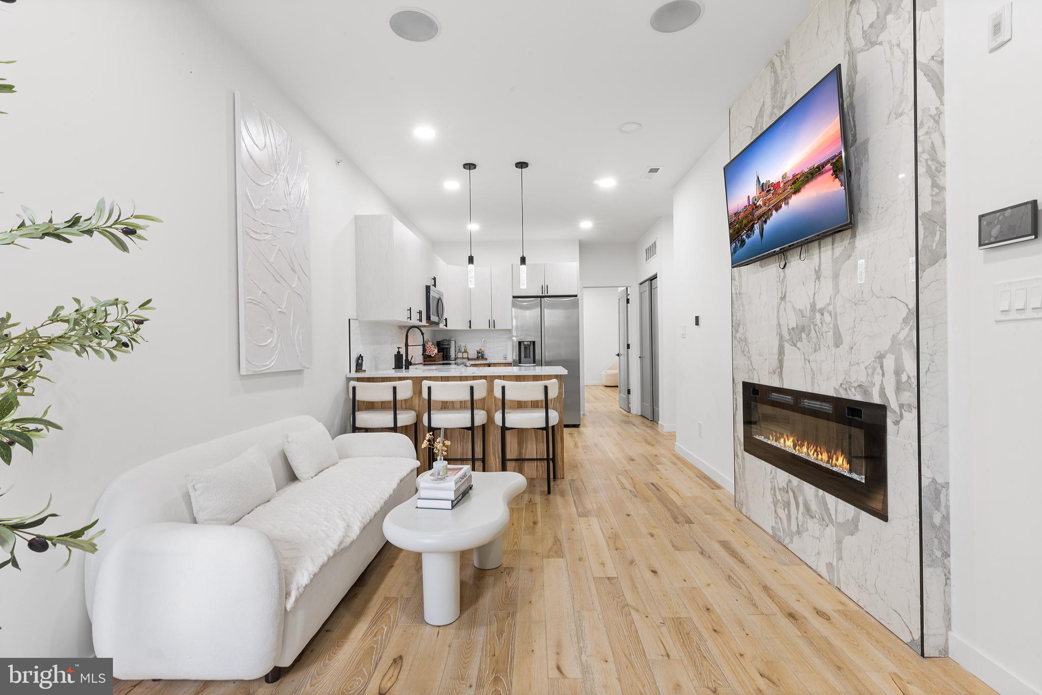 Experience sophisticated living in the sought after Haverford North neighborhood near University City. Tucked away in this distinguished area is a stunning 2-bedroom, 2-bathroom luxury condo, where style and elegance meet at every turn. Inside, you'll find a contemporary sanctuary thoughtfully designed to captivate the senses. The chef-inspired kitchen boasts cutting-edge stainless steel appliances, polished quartz countertops, and bespoke cabinetry—offering a perfect balance of function and flair.

Enjoy seamless sound with a built-in Bluetooth speaker system, filling the space with rich, ambient audio that elevates the atmosphere. Walk across gleaming Spice Oak White hardwood floors to discover a striking tiled accent wall, featuring a cozy fireplace that brings both warmth and visual charm to the living area.

Head up to the expansive rooftop deck, where panoramic, 360-degree city views await—providing a serene escape from the bustle below. Perfectly located near University City, this residence offers unmatched convenience, making it ideal for balancing professional pursuits and leisurely moments.

 This is more than a home—it's a refined lifestyle, where luxury, comfort, and attention to detail converge in perfect harmony.  2 year minimum lease term. Apply today. Fully Furnished.