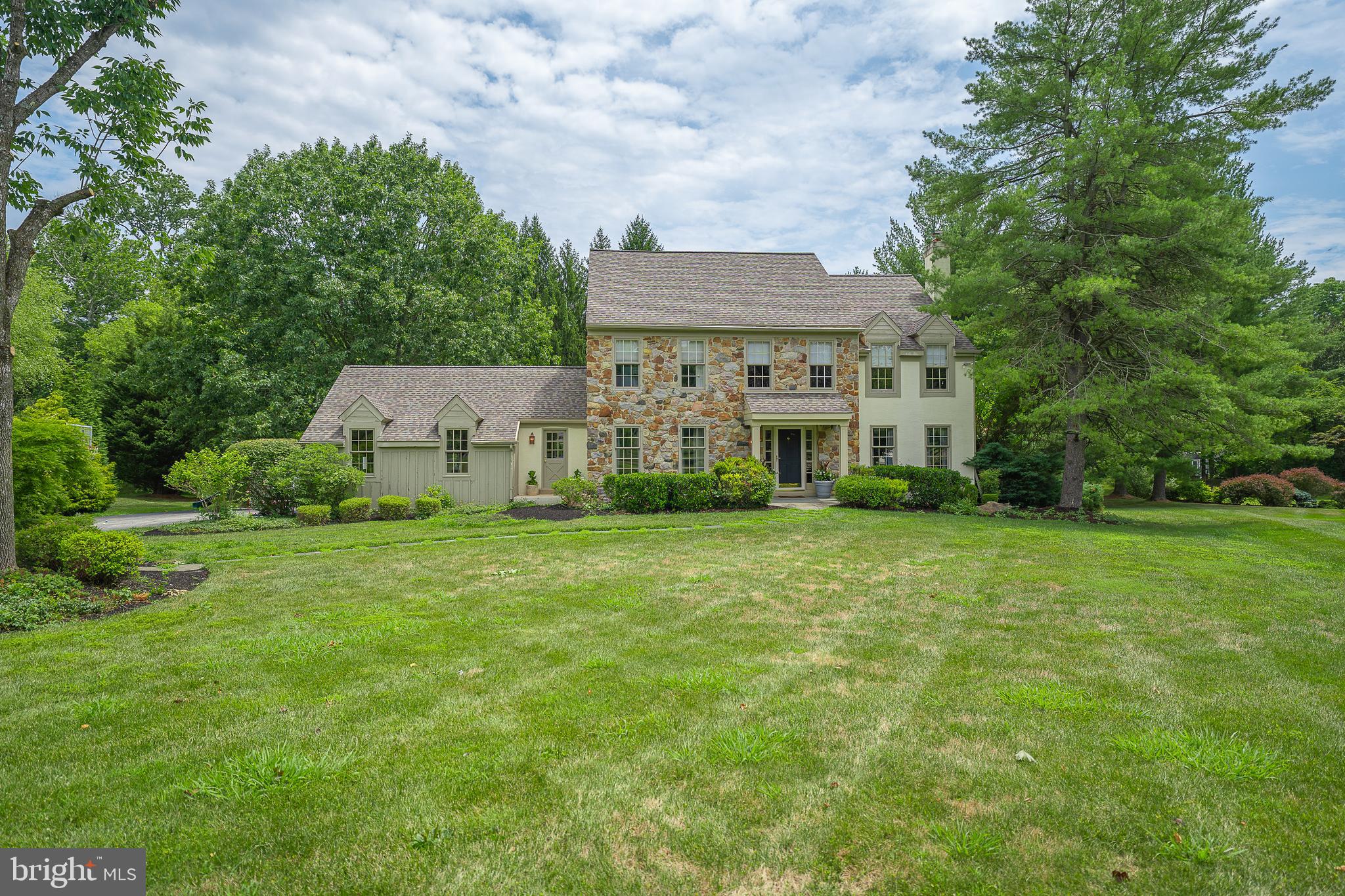 Nestled on a cul-de-sac in the estate section of Devon, this classic colonial offers a combination of gracious living with an exceptional neighborhood and school system.  A generously sized dining room invites entertaining while the fireside living room opens to a private corner office/study with French doors providing a quiet retreat.  The chef-worthy kitchen with granite, stainless and large center island flows into the most warm and comfortable family room with charming fireplace, natural light from large windows and double skylights plus a lighted bar. A wonderful space for family gatherings. Fabulous screened porch is a perfect spot to enjoy morning coffee while overlooking the large (1.9 acre) tree lined private back yard. A wonderful fully carpeted finished lower level adds to family enjoyment. New roof and HVAC (2023) included as well. Lovely turned staircase leads to corner primary bedroom with walk-in closets and wait till you see the exquisite bath!! Three additional bedrooms share the hall bath.  Enjoy the luxury of this remarkable home, great Main Line location, quiet privacy and convenience.  You will love living here!