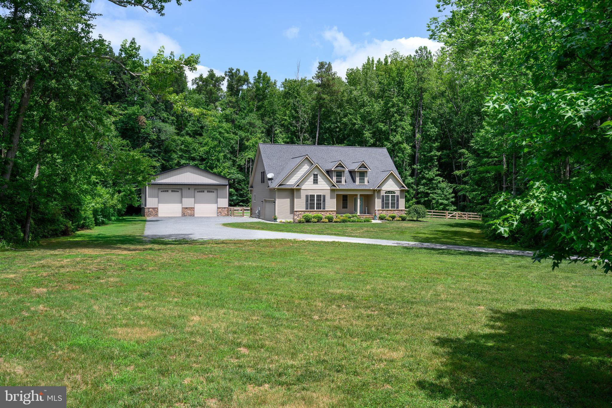 Welcome to 702 Coon Box Road! This beautifully crafted 3 bedroom, 2.5 bath home offers almost 2,600 sq ft of refined living space on a 5+ acre serene private lot on the outskirts of the town of Centreville. The first floor boasts an open floor plan with a kitchen, dining room, and living room anchored by a stunning floor-to-ceiling stone fireplace, along with a convenient laundry room. The first floor primary suite impresses with a walk-in closet and a spa-like bath featuring a walk-in tile shower, soaking tub, and double vanities. Upstairs, two large bedrooms with walk-in closets and a versatile bonus room offer flexibility for any lifestyle. Outside, the 36x60 detached building, heated and cooled, is in a league of its own, featuring a professional shop, private office, finished recreation room with a custom bar, and a finished loft. Top it all off with a large paver patio and fire pit, and you have a property that truly has it all. Coming Soon! Contact me today for more information and to schedule your tour!