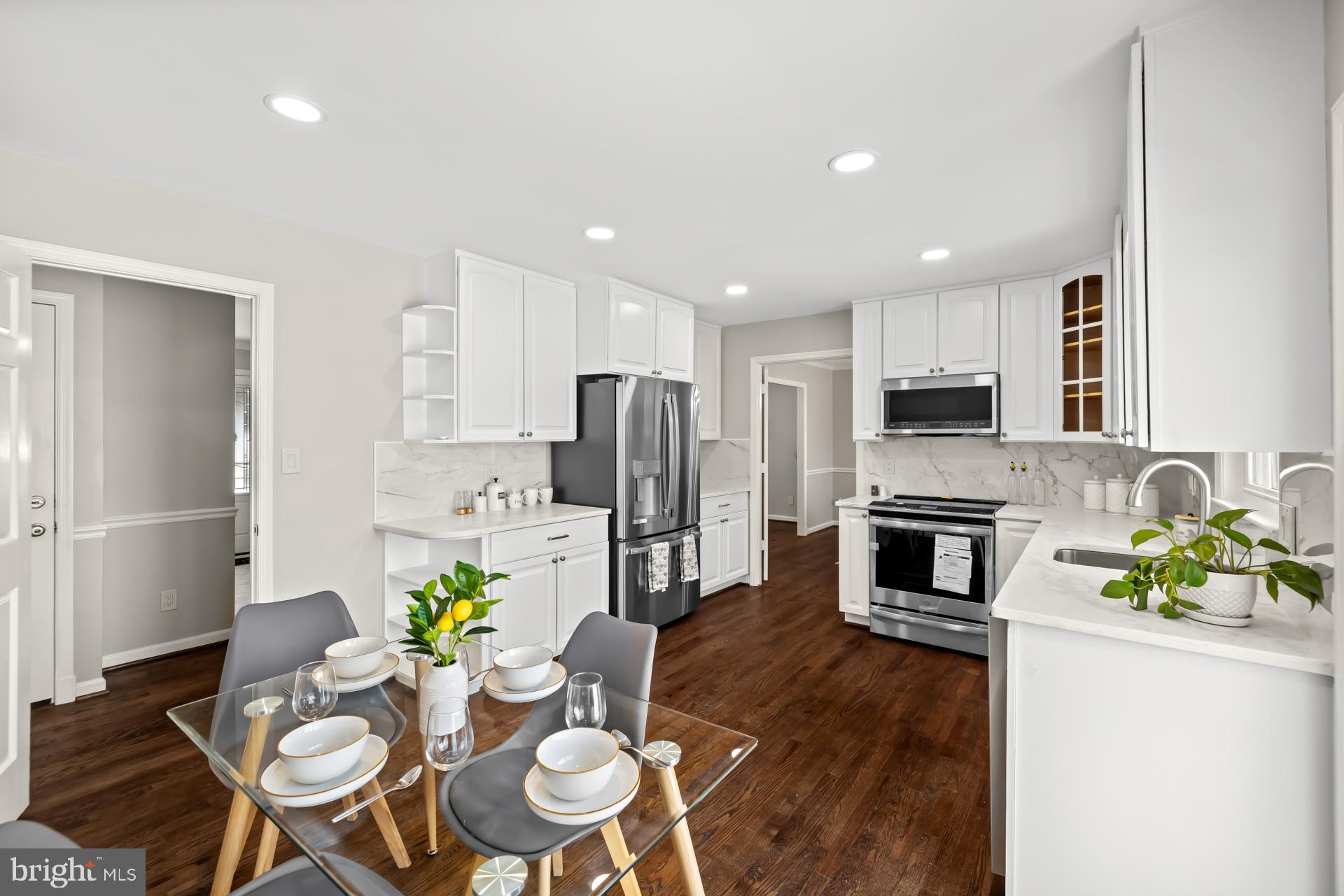 All new mechanicals! New HVAC system, new hot water heater, new electrical panel, new appliances, new roof!
Welcome to this gorgeous, fully renovated 4 bed, 3 full and 1/2 bath, single-family home, nestled in the heart of Colesville /Silver Spring.
This fabulous home features a fully renovated kitchen with quartz countertops, 42 inch wood cabinets, under mount cabinet lighting, all brand new stainless steel appliances, refinished genuine hardwood flooring, and fully renovated bathrooms with Wi-Fi Bluetooth speaker in the master bath. Brand new HVAC system, hot water heater, new electric panel, and brand new washer, and dryer !
All of the lighting in the entire home has been replaced along with added recessed lights.
Brand new roof, updated windows, two cozy wood-burning brick fireplaces.
This rare gem is sitting on an expansive 1/2 acre lot. 
The home is surrounded by a beautiful mature tree line and landscaping ,situated in a quaint, quiet neighborhood.
Very spacious backyard, huge rear deck with steps that lead down to the brick and stone terrace expanding across the back of the home .
 Large driveway and carport totaling as many as five parking spaces. There is also a wide stone stairway leading from the front of the home down to the rear brick terrace.
This spectacular home also offers a separate licensed apartment dwelling unit with a separate rear entrance. 
This  unit can be used as an income generating apartment dwelling, an au pair suite ,or an in-law suite. The apartment unit offers a fully equipped kitchen with stainless steel appliances, a living room area, one full bath ,and a separate large spacious bedroom. There is also a cozy nook that can be utilized as an office space/den, etc. 
The location is fabulous and in very close proximity to public transportation, parks, ICC , shopping, and restaurants. 

The list goes on!

This move-in-ready home is the perfect blend of comfort, convenience, and community.

Schedule your private tour today — this Silver Spring gem won’t last long!
