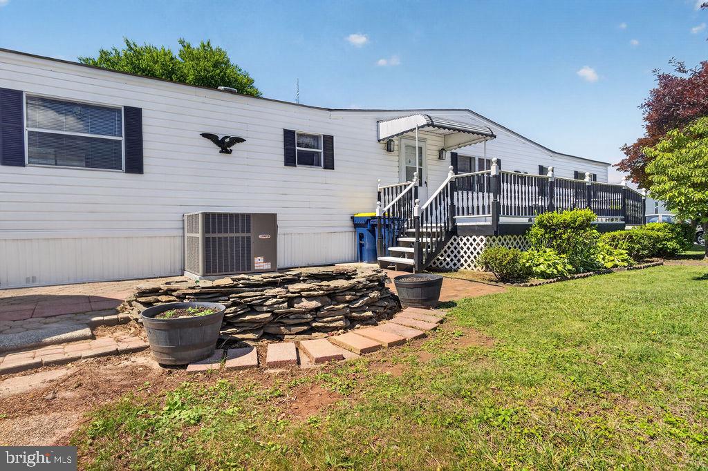 Wow! Locations like this one in Winterset Farms Manufactured Home Community don't often become available! This home is on an awesome corner lot with a large yard, lots of mature trees and landscaping and overlooks the open field/playground. An oversized deck with an awning over the front door as well as a shed are also included.  The open floor plan in this home is awesome, and the living room opens up to the large kitchen with plenty of cabinets and counter space as well as a lighted ceiling fan. Refrigerator is included.   There is also a laundry room (washer and dryer are included). There are 2 bedrooms, 2 full baths and this home has so many windows throughout for even extra natural light. The 2 bedrooms are at opposite ends of the home (each with its own bathroom) for extra privacy. The main bedroom has a walk-in closet and an updated, oversized white vanity in the bathroom. HVAC is brand new! Great home, nicely maintained on an awesome lot! Manufactured home loans are acceptable but homes not eligible for a mortgage since it is a lot lease and you do not own the land (Owner was tax exempt)