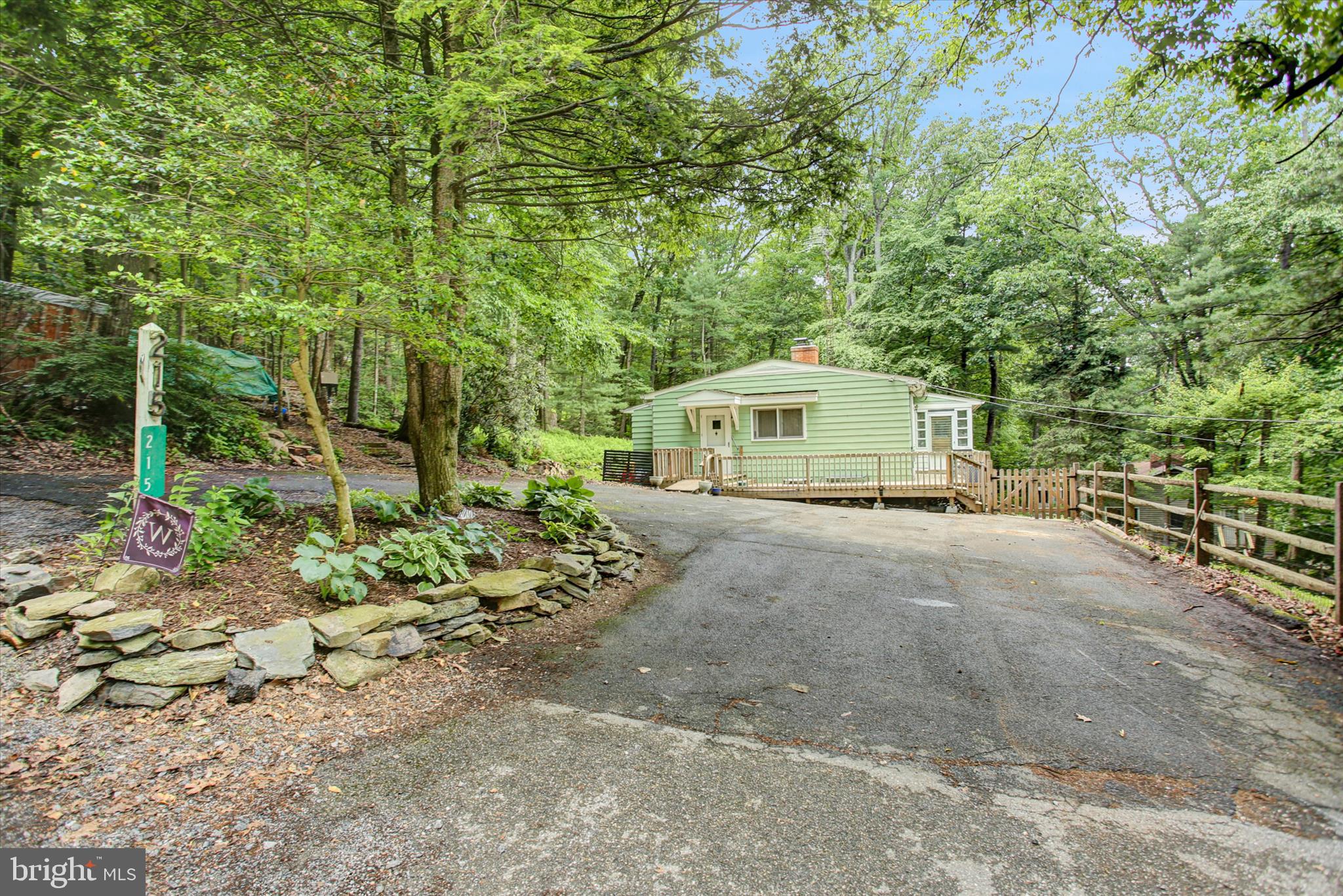 Welcome to this charming 2 bedroom, 2 bath home nestled on a peaceful 0.61 acre wooded lot.  Offering 1,174 square feet of comfortable living space, this property provides a tranquil woodland setting where you can enjoy the beauty of nature right outside your door.   The lower level adds valuable flexibility with a finished room that could serve as a home office, hobby space, or guest room. The basement also offers abundant storage space, providing plenty of room for seasonal items, outdoor gear, and household essentials. Conveniently located near Gettysburg, Caledonia State Park, Liberty Mountain Resort, hiking trails and local wineries, this home combines a secluded, wooded feel with easy access to recreation, dining and amenities.  Don't miss this opportunity to own your own woodland retreat.