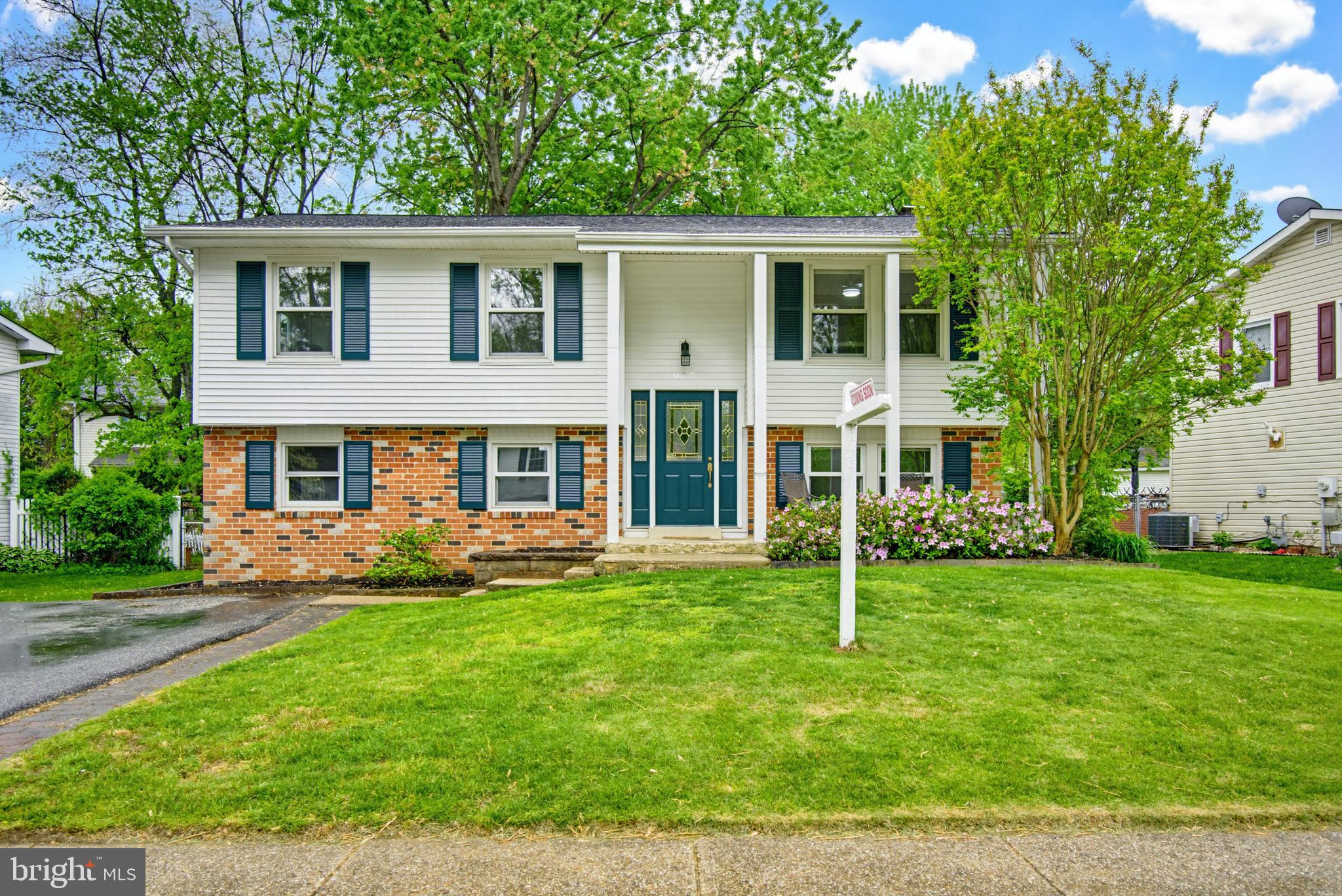 FANTASTIC 4 Bedroom 2 Full Bath brick and vinyl siding Split Foyer in sought after neighborhood. Home boasts spacious covered front porch; Large Lower Level Primary Bedroom with walk-in closet and Full Bath; Updated Kitchen with 42" Oak Cabinets, Granite Countertops, and Stainless Steel Appliances; Large Eat-In Kitchen dining area; Wood floors on Main Level. Fresh Carpet and Paint throughout home. Both Full Baths have been updated. Spacious Laundry/Utility Room with rear exterior entrance. Lower Level Den complete with stone fireplace with quality wood-burning stove insert. Natural Gas Heat with Central Air Conditioning and Natural Gas Water Heater.  Seller will provide a home warranty with Guard Home Warranty.  Conveniently located near schools, shopping. and major commuter arteries.