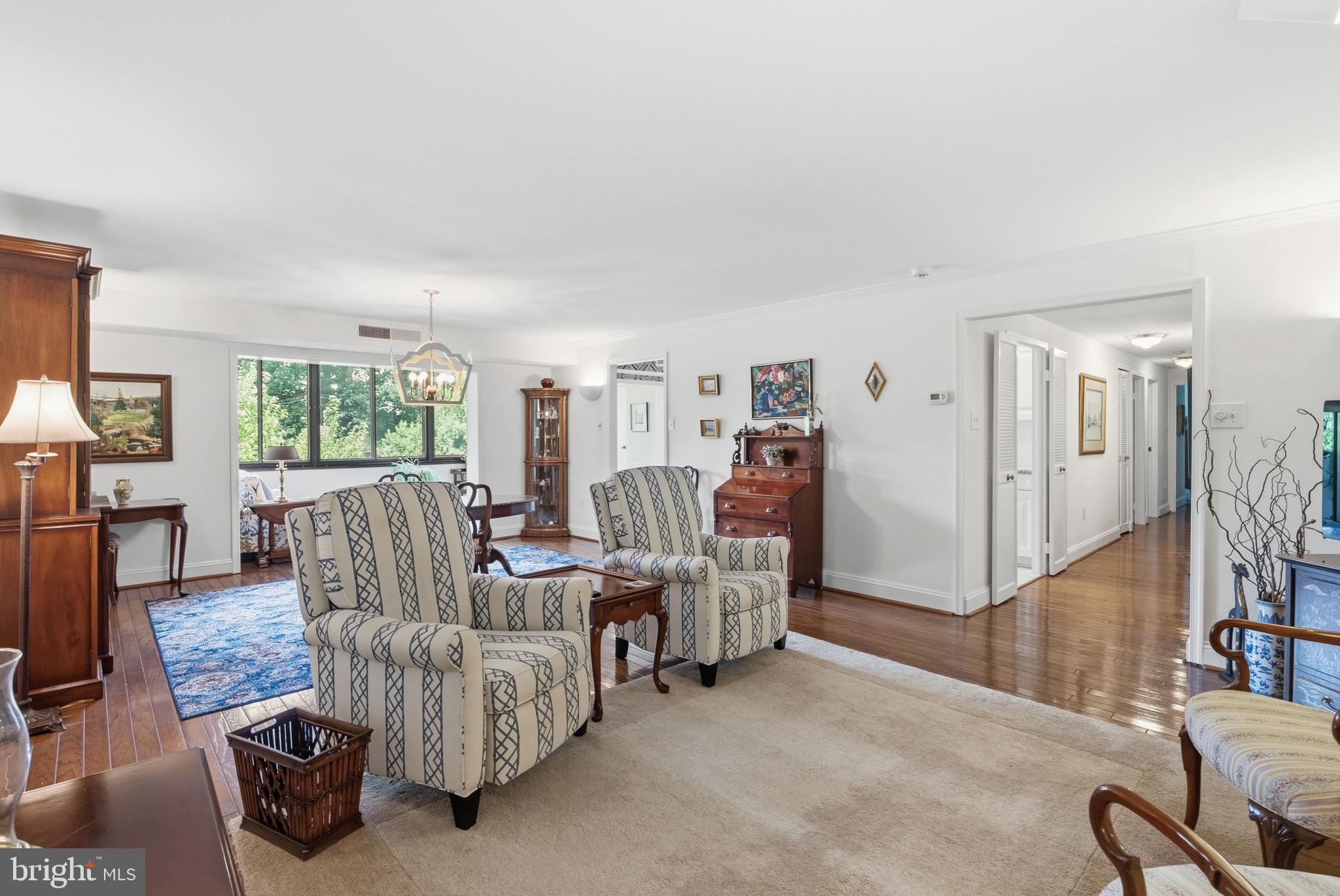 Warm, easy living in Lower Merion Twp with the space and convenience buyers want on the Main Line. Unit 304 at 930 W Montgomery Ave offers a 1-level layout with a large foyer, open living and dining area, eat-in kitchen, enclosed sunroom with views the Shipley School, in-unit laundry, and a primary suite with walk-in closet. The primary bathroom was remodeled in 2021, adding a useful update to this 1,660 sq ft home. Enjoy elevator access and Benson House amenities including a fitness center, library/social room, game room, owner storage, bike storage, lobby/front desk service, and parking for owners and guests. Close to Bryn Mawr shops, dining, rail, and community destinations.