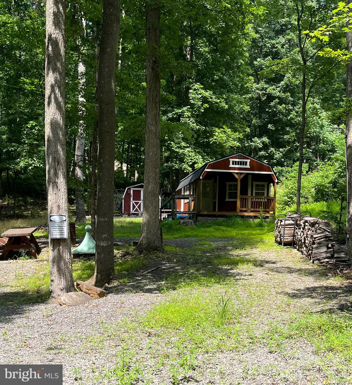 Escape to the peace and beauty of this 2.18-acre wooded retreat, ready for your vision. The property features an unfinished shed along with existing electric, well, and septic, giving you a head start on creating the perfect weekend getaway, dream cabin, or full-time home. Prefer to keep it simple? It's also an ideal spot for camping and enjoying the great outdoors. Just minutes away, you'll find access to the sparkling Cacapon River, perfect for relaxing float trips, fishing, kayaking, or cooling off on warm summer days. Spend your evenings gathered around the campfire beneath a canopy of stars while listening to the peaceful sounds of nature. Whether you're looking for a private escape or the perfect place to build your future, this beautiful property offers endless possibilities. Come experience it for yourself and make this slice of paradise your own.