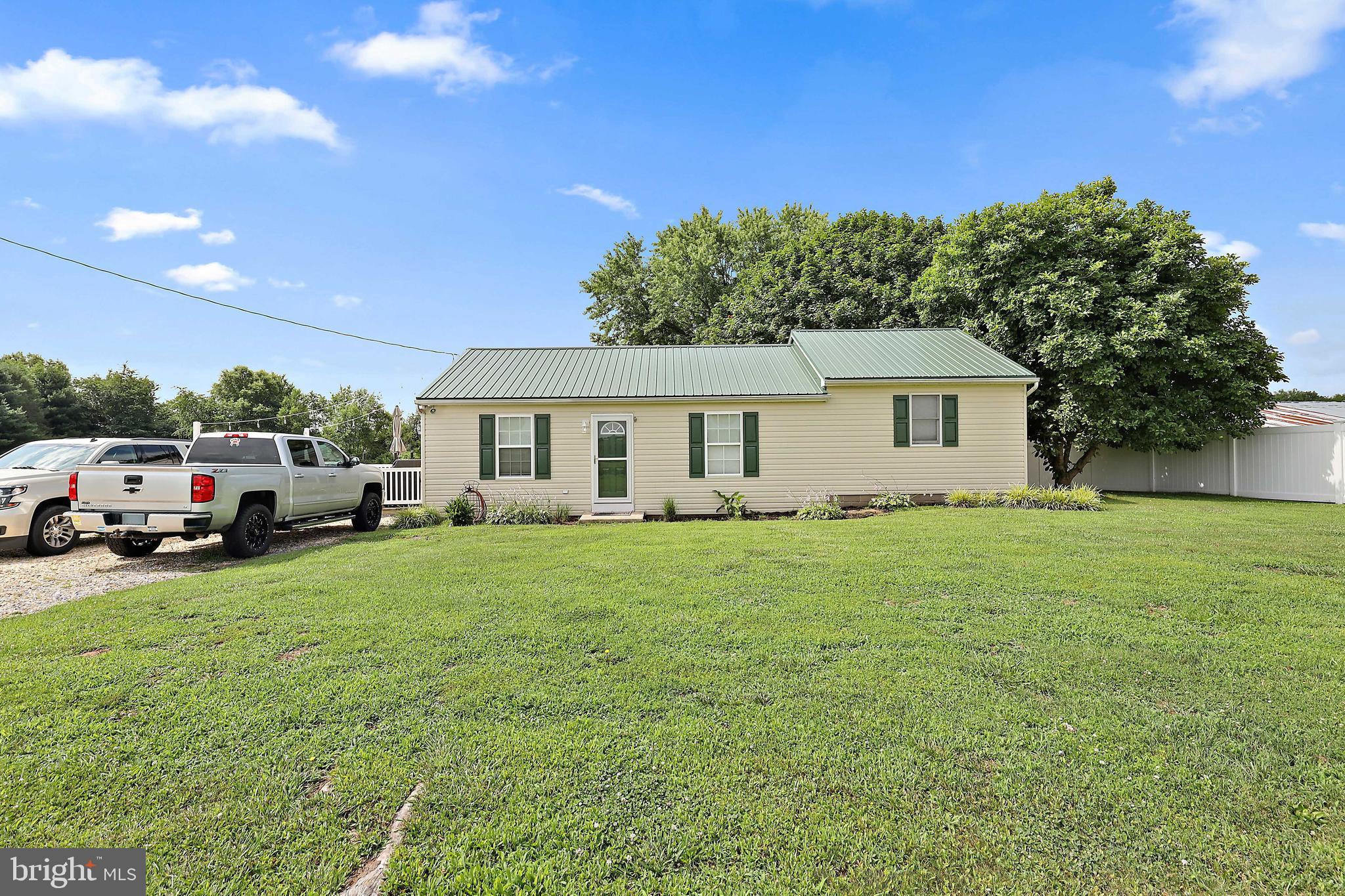 Don't miss out on this updated rancher located on a beautiful 1 acre lot.  New doors and freshly painted through out. Newly finished porch with new windows and flooring. Huge new kitchen pantry. Enjoy the beautiful sunsets and relax on the 16' X19' deck. Brand new 20'x36' pole barn. High ceilings and LED lighting through out. New 10' x 12' storage shed. Brand new 200' long 6' high privacy fence. This home has it ALL.