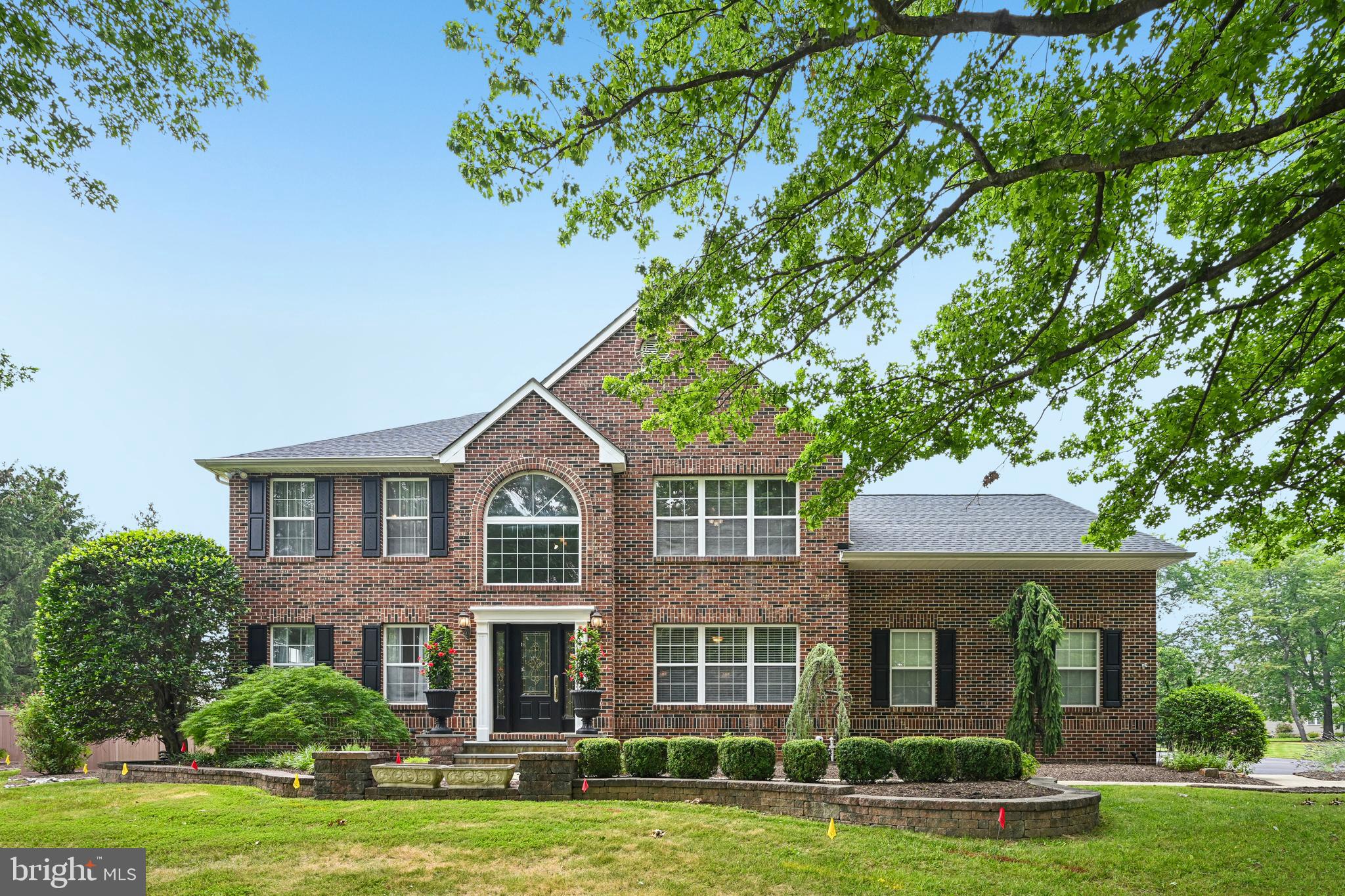 SHOWINGS BEGIN WEDNESDAY, July 22nd however, showings can be scheduled! Rarely does a home of this size, versatility, and quality become available in the highly sought-after Hidden Oaks community of Yardley. Far beyond the ordinary, this exceptional residence has been extensively expanded and redesigned, creating a one-of-a-kind home unlike anything else in the community.  Offering 4,582 sq. ft. of above-grade living space plus a finished basement on a beautifully landscaped .64-acre lot, this exceptional residence has been masterfully reimagined for today's evolving lifestyles, including multigenerational living, aging in place, extended family, or long-term guests.

The flexible floor plan features two spacious primary suites, including a private main-level suite with its own living area, full bath and private entrance, creating an ideal space for family members or guests seeking privacy and independence. The second-floor primary suite offers a luxurious jetted soaking tub and a laundry area. Three additional bedrooms are upstairs. Many of the home's expansive rooms can easily serve as home offices, fitness rooms, playrooms, media rooms, or hobby spaces.

At the heart of the home is a spectacular gourmet kitchen designed for both everyday living and entertainment. Premium Thermador appliances include a 6-burner gas range with griddle and 2 electric ovens, refrigerator, dishwasher, and built-in beverage refrigerator. An oversized 5 x 12 granite island comfortably seats 6-10 guests and opens seamlessly to the dining and family rooms with each having their own fireplace (one gas and the other wood for versatility), creating inviting gathering spaces.

The finished basement expands the home's versatility with a separate heating system, dedicated exhaust fan for arts and crafts, hardwiring for a home theater, Bilco walk-out access, half bath and a full-size Samsung washer and electric dryer. A GE washer and electric dryer are also included in the master bedroom suite for added convenience.

Outside, enjoy exceptional privacy in the expansive backyard featuring mature landscaping, a fire pit gathering area, raised deck, patio area and a 12' x 20' shed complete with electricity, its own electrical panel, and plywood-lined walls perfect for a workshop, studio, or additional storage.

Additional highlights include a roof approximately a year old, a three-zone HVAC system with a mini-split, public water, public sewer, natural gas, new carpeting and fresh paint throughout most of the home, hardwood flooring in one upstairs bedroom, generous closet space, and an HSA Home Warranty included with the sale for added peace of mind.

Homes offering this combination of space, flexibility, quality construction, and premium amenities are exceptionally rare. Please review the attached Features List to fully appreciate everything this remarkable Hidden Oaks property has to offer. Be sure to view 3D tour, floor plans with measurements and virtual tour of home online.  Guest are kindly asked to remove their shoes as they enter.  Property is being monitored.