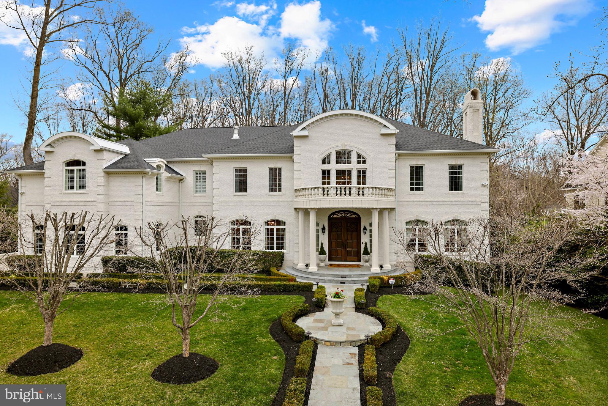 Nestled in a picturesque setting in one of McLean’s most sought-after neighborhoods has a fabulous, private backyard! This home features over 11,000 square feet of sophisticated living space complete with a new roof, generator, elevator and hardwood floors, Main Level en suite Bedroom and luxurious finishes at every turn. The allure begins with a spectacular and elegant 2-story Foyer with a curved staircase that invites you to the formal Living Room and banquet-sized Dining Room both with fireplaces. The private Study/Office has built-in bookshelves and lots of light. The 2-story Great Room is stunning with soaring ceilings, floor-to-ceiling windows and an elegant fireplace that opens to the Chef’s Kitchen featuring top-of-the-line appliances including SubZero Refrigerator/ Freezer, Viking Range, separate oven, microwave, warming drawer, built-in espresso machine, walk-in pantry and Breakfast Room. There is also a Butler’s Pantry with wine storage and cabinets with glass doors. The fully equipped Main Level Catering Kitchen is great for entertaining. The Upper-Level Owner’s Retreat has a Sitting Room, Breakfast Bar with beverage refrigerator, two huge walk-in closets, a private Study/Office, a Luxurious Bath with separate vanities, a steam shower and jetted tub. The Upper Level also includes three additional en suite Bedrooms and a terrific Laundry Room. The walk-out Lower Level is open and spacious with a Recreation Room, Wet Bar complete with wine refrigerator, dishwasher,  bar seating, temperature-controlled Wine Cellar, Game Room with 3 sided fireplace, Fitness Room with full Bath and Sauna, Theater Room and additional en suite Bedroom. The generous outdoor living spaces include a limestone Terrace off the Kitchen/Breakfast Room that has outdoor cooking and grilling. A covered Terrace off the Lower Level Recreation Room provides an exceptional venue for hosting friends and family, dining alfresco or simply taking in the sweet serenity that encompasses the property.