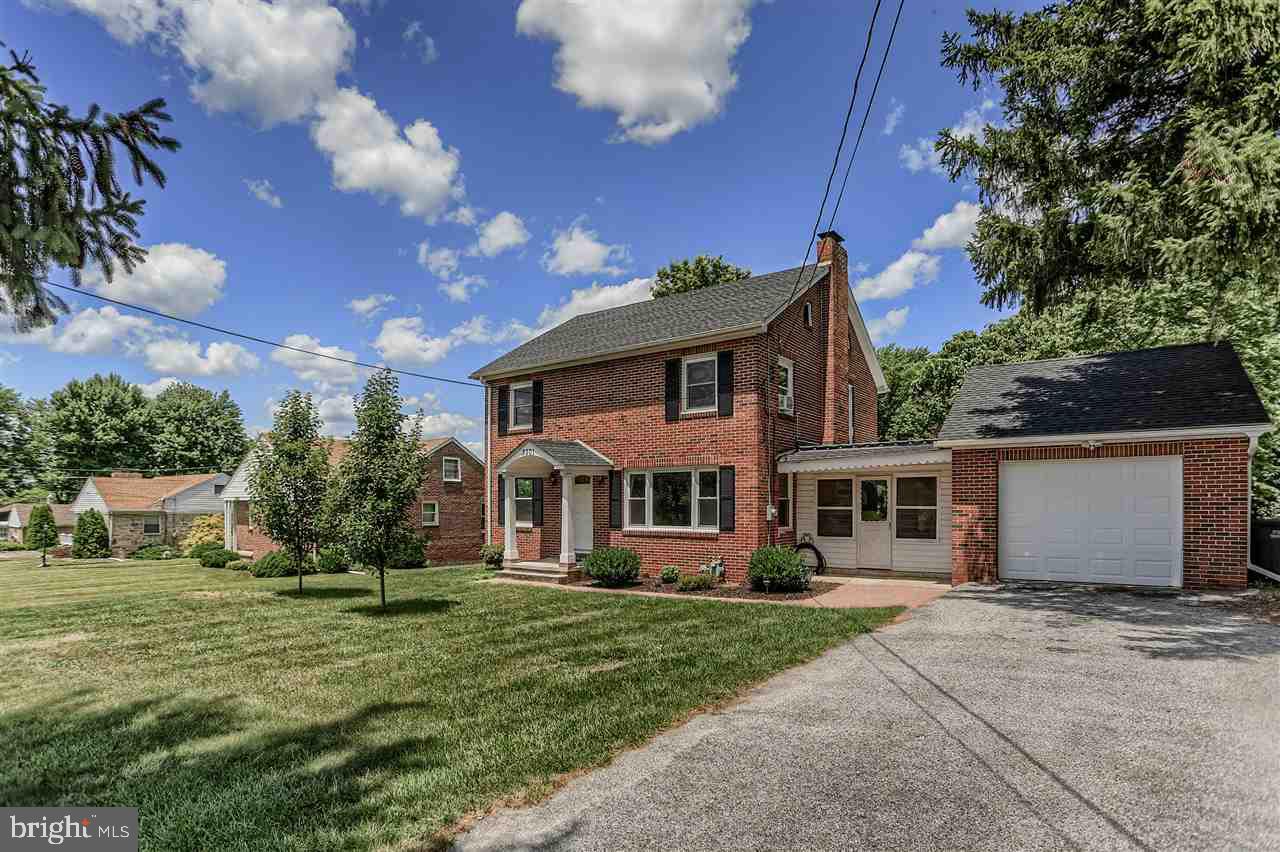 Beautifully remodeled 4 bedroom brick colonial with an oversized 1 car garage and breezeway.  Beautiful new oak kitchen with granite counters, tile backsplash & stainless appliances.  Remodeled bath with Travertine tile in the tub/shower. Refinished hardwood floors.  New windows & doors. New boiler. New electric service.  New roof. Walk-up attic. Mudroom.  Breezeway with jalouzy windows & new wood ceiling. Covered flagstone patio & great yard.