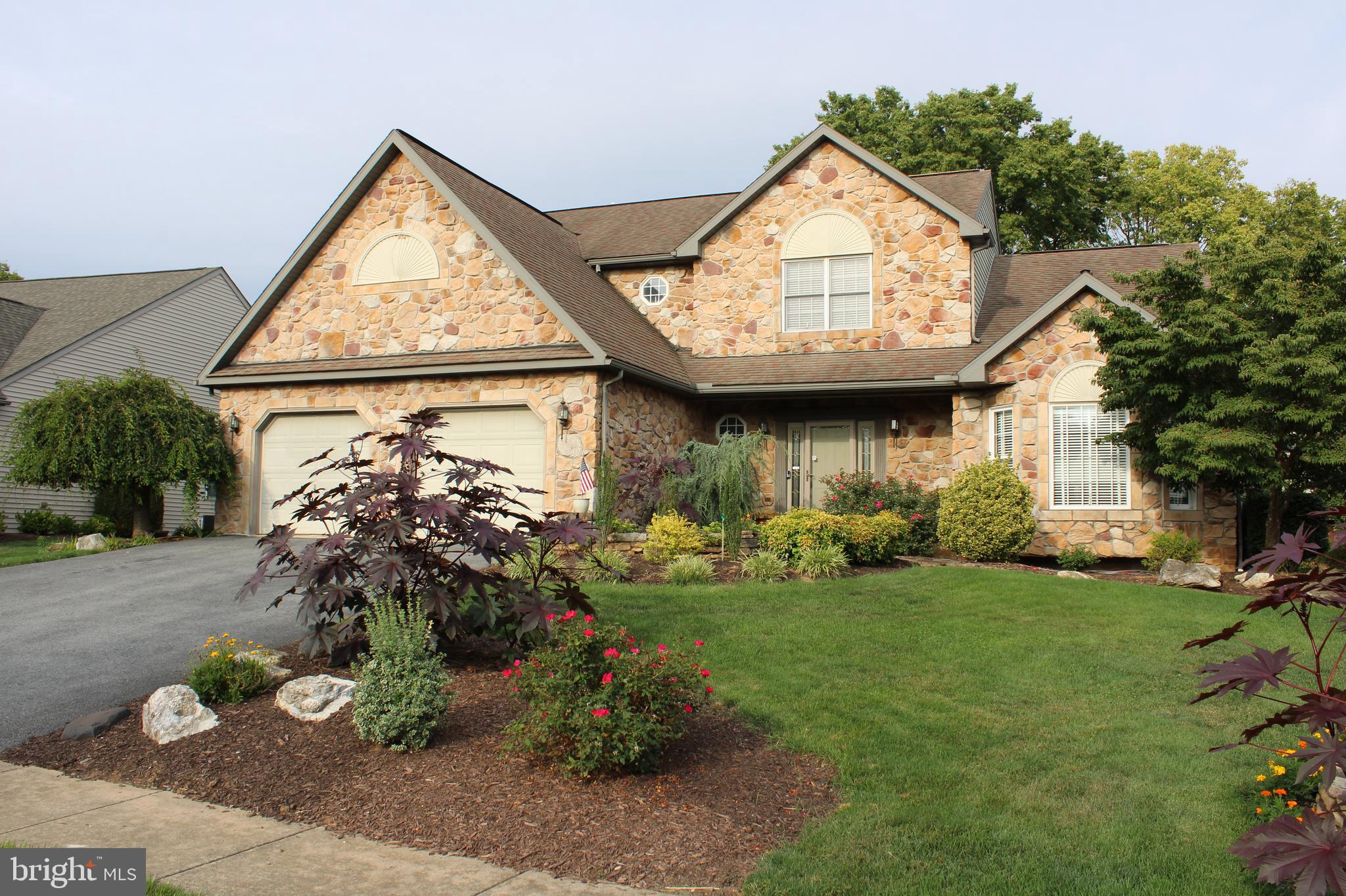Just Reduced , Green Valley Estates home with a first floor Master bedroom and bath, Vaulted family room with rear stairway to second floor and loft overlook. Hardwood flooring , Stone faced gas fireplace, granite counter tops in kitchen .  Extensive landscaping and hardscaping  and a very private  back yard . Fast Possession available