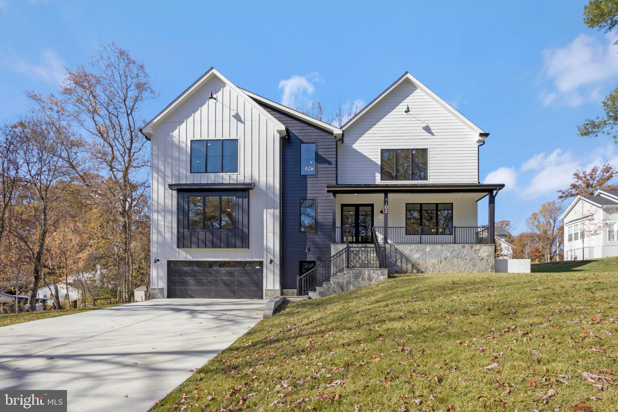 ***Newly completed! Just outside the beltway in the Woodson HS pyramid, this contemporary home is a masterpiece of design and craftsmanship situated on over a half acre lot. Spanning over 6,200 square feet of luxurious living space, this property features 9’ ceilings across all three levels, hardwood floors on the upper two levels and luxury vinyl plank on the lower level. The main level hosts a family room and modern gas fireplace with custom surround, setting a warm, inviting atmosphere.  The kitchen is a chef's dream, with Designer Series Maple Cabinetry, high-end quartz countertops, double 10-foot center islands, and a suite of Thermador stainless-steel appliances. The butler’s pantry and oversized walk-in pantry provide ample storage and convenience. The dumbwaiter elevator allows for ease when bringing in groceries and other items from the garage. You can expand your living space by opening the ten foot wide sliding glass doors to the spacious Trex deck. The large separate dining room is perfect for hosting all your family gatherings. Features include custom wainscoting, a tray ceiling and oversized windows that bring in abundant natural light.  Off the main entrance you will find the perfect home office with glass french doors.  This space can also be used as a main level bedroom as it features a full bathroom and walk-in closet.  The main level is finished with the perfect adult clubroom space.  Enjoy coffee and a book or cocktails with friends. 

The oak staircase with modern cable railings leads to the upper level with the primary bedroom and three additional spacious bedrooms, each boasting their own ensuite bathrooms and walk-in closets, ensuring ample privacy and convenience for residents and guests alike. Delta Shower systems, designer tiles, and maple vanities in all bathrooms set a standard of luxury. The primary bathroom showcases a custom design with dual sinks, a free-standing tub, and a modern barrier-free shower. The second-floor laundry room features washer/dryer hookups and built-in cabinetry with quartz counters. The home is illuminated by recessed and overhead lighting in all rooms, with bedrooms pre-wired for ceiling fans, ensuring comfort and convenience.

The finished basement includes a large family area, fitness room, and a bedroom suite with a walk-in closet and full bathroom. This home is equipped with two 40-gallon water heaters and an advanced insulation package, ensuring energy efficiency.  The garage is equipped for electric vehicle charging, highlighting the property's modern amenities. 

The home's exterior is adorned with James Hardie - Lap Siding with ColorPlus Technology, complemented by a 30-Year Architectural Roof Shingles and striking Metal Roof Accents. Pella Windows frame the property, ensuring durability and style, while oversized 6-Inch Aluminum Gutters and downspouts, along with an interior and exterior foundation drain system with sump pump.  This contemporary luxury home combines state-of-the-art features with meticulous attention to detail, offering an unparalleled living experience.