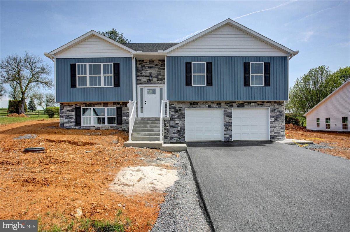 Welcome to Antietam Commons! Ashlyn Homes is offering 3 different split foyers on Benning Ave. Lot 24 house is currently under construction, and are slated to be finished 9/1/2026-10/1/2026. Prices start at $314,900, and the seller is offering $2,000 buyers paid closing cost! See the photos for the exterior of houses & colors. Lot 24 is exterior color is Blue/White. Interior photos are of a similar house. Each home features an open concept kitchen (island included), dining, and living room areas. All Kitchen appliances included. Granite Countertops, LVP flooring through out, except for the bedrooms, which will have carpet. The master bedroom features its own private bath, along with a closet. Full Poured concrete foundation. Central A/C and Electric Heat pump, and a 12x12 composite deck off the rear. The lower level family room/ bedroom area, and bath will remain unfinished at the list price. Builder can finish it to match the rest of the property for an additional $20,000. Work can be completed prior to settlement, so you won't live in construction debris! Call today to find out more about this new construction single family home!