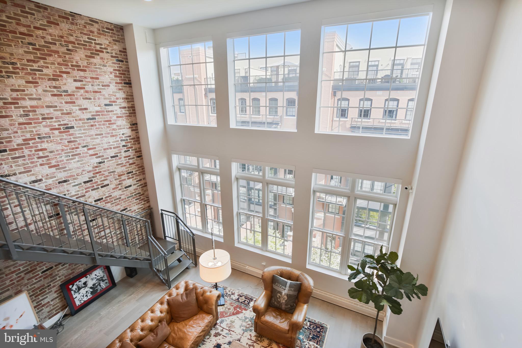 2 Story Penthouse at The Select at Gaslight Square offers modern comfort & luxury! Direct Elevator Access to both floors! Living Room w/19ft Vaulted Ceilings, Gas Fireplace & Loft. Open Gourmet Kitchen with over-sized island/breakfast bar, 6 burner Wolf Stove & Subzero Refrigerator. Two Primary Suites! 2.5 Baths. Open Loft, Private rooftop terrace with gas hookup for cooking, perfect for entertaining. Large storage room, 2 assigned arking spaces Conveniently located between Rosslyn and Courthouse Metros and minutes to DC!