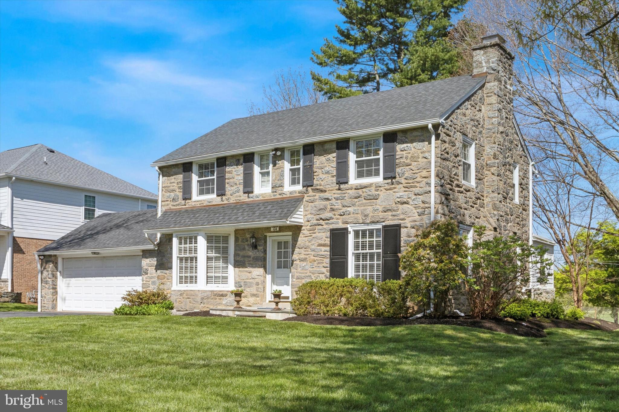 Welcome to 104 Golfview Road, a beautiful stone colonial in the highly sought after Merion Golf Manor neighborhood. This home sits on one of the premier lots embracing an exclusive location with an incredible backyard that backs up to the esteemed Merion Golf Club overlooking the 8th fairway. In addition to its exclusive location, this home has been upgraded and updated throughout.  Fall in love with the stone exterior complimented by the new Hardie board siding offering excellent curb appeal to this amazing 3 bedroom, 2.5 bathroom home with just under 3,000 square feet of finished living space. Step inside to be greeted by glistening refinished hardwood floors that guide you through the center hall entrance and span throughout the home.  To the right reveals a spacious formal living room with a wood-burning stone fireplace. To the left is a sophisticated formal dining room decorated with custom Thibaut wallpaper, wainscot molding and enhanced by the large bay window.    Entertaining and cooking is made enjoyable with the brand-new kitchen with high-end GE Cafe appliances including a bluetooth induction stove, plenty of cabinetry, gorgeous quartz countertops all accented by a stylish solid quartz backsplash. The kitchen also features built-ins that surround the breakfast table. Through the kitchen find the family room addition that features the gorgeous stone exterior wall surrounded by a wall of windows that allows for abundant sunlight.  Off the family room is the truly incredible yard with a brand new spacious deck overlooking the level rear yard with incredible views of the golf course (hosting the 2030 US Open!!).  This is the ideal spot to relax and entertain; a true extension to your home.  Back inside, the main floor is complete with a powder room, mudroom, and direct access to the oversized 2-car garage!  The second level is home to a spacious primary ensuite with two closets and full bathroom with marble tile.  The two evenly proportioned secondary bedrooms have nice-sized closets and share the full hall bathroom with a shower/tub combination vanity for storage, marble tile and neutral fixtures. Descend to the newly partial finished lower level where you will find excellent space for a bonus/flex room and in-home office.  Plus, the unfinished portion offers a laundry room and additional space for storage. Notable upgrades include: (New deck 2022, New Hardie Board Siding 2022, Partially finished basement 2021, New roof 2019, New powder room 2019, New remodeled kitchen 2019, New upstairs hall bath 2016, & New Primary bath 2007).  104 Golfview Rd falls within the highly coveted neighborhood of Merion Golf Manor, where events are held throughout the year. This home is conveniently located nearby to local public and private schools, a wide variety of dining in Ardmore and Oakmont, parks & playgrounds, Haverford Twp Rec Center, Haverford College and the YMCA. Do not miss your opportunity to own this truly special home in a truly superior and desirable location.