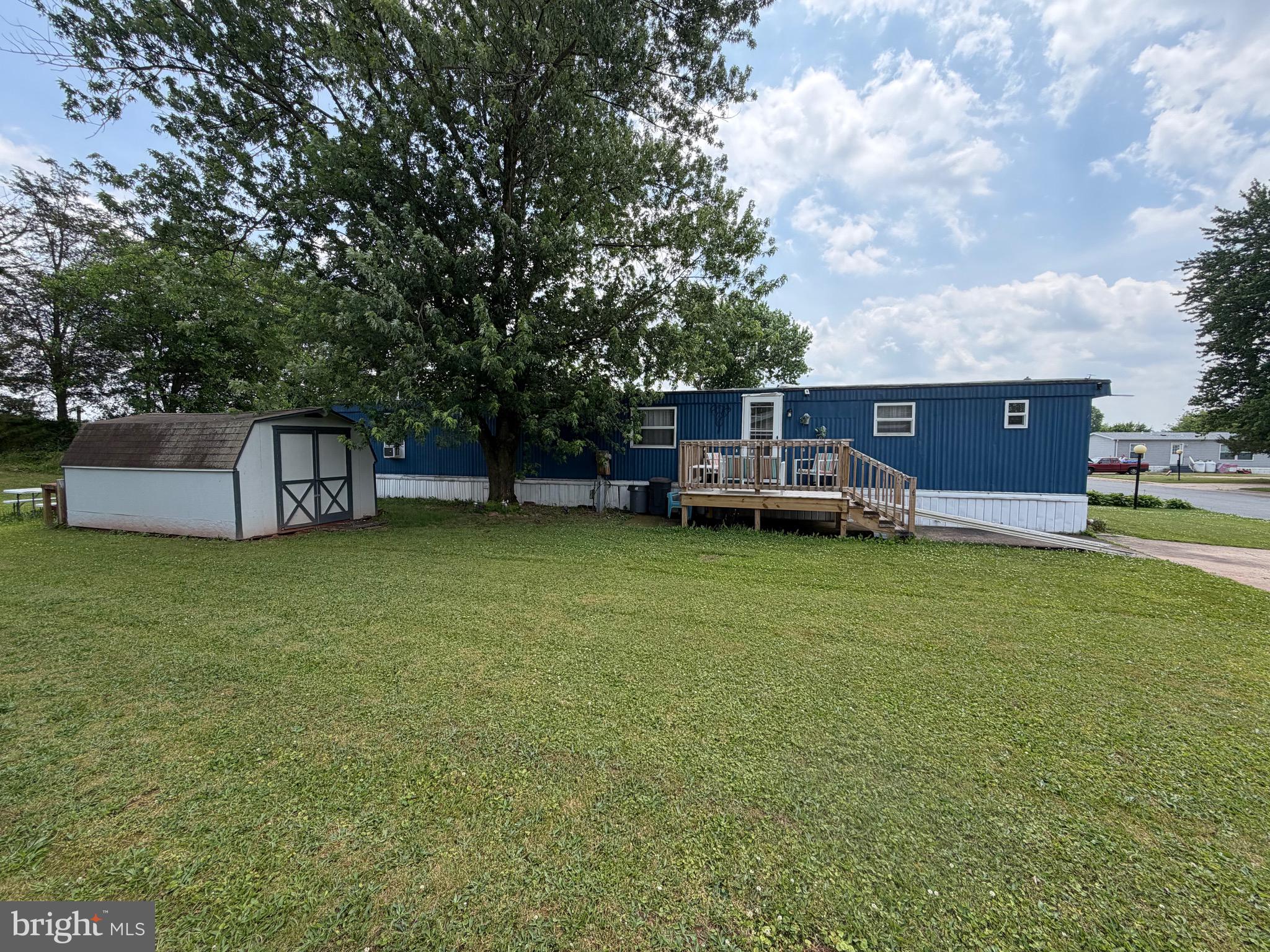 Welcome home to this beautifully updated 3-bedroom, 2-bath ranch-style manufactured home located in the desirable Pine Manor community. Offering 938 square feet of thoughtfully designed living space, this move-in-ready home features a bright open floor plan, a stylish kitchen with a center island and pantry, and a split-bedroom layout that provides added privacy for the primary suite. The laundry area is conveniently located off the kitchen for everyday ease.  
Step outside and enjoy the custom-built deck—perfect for entertaining, relaxing, or enjoying your morning coffee. A large storage shed provides additional space for tools, seasonal items, and outdoor equipment. Surrounded by scenic farmland and mature trees, this property offers peaceful living while remaining conveniently close to Middletown, Elizabethtown, Harrisburg, Hershey, and Lancaster. Commuters will appreciate easy access to major highways, Amtrak service, and Harrisburg International Airport.  
Whether you’re a first-time homebuyer, downsizing, or looking for affordable, low-maintenance living, this charming home offers comfort, convenience, and value in a welcoming community.