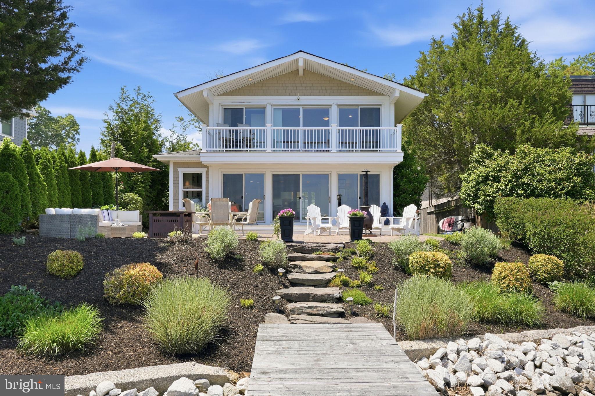 This coastal home in the sought-after Chalk Point community offers the best of waterfront living. Wake up in the waterfront primary suite with sweeping 180-degree views and enjoy your morning coffee from the private balcony overlooking the water. Designed for both privacy and entertaining, the home features a spacious deck and patio off the main living area, perfect for outdoor gatherings and waterfront entertaining.

The private pier w/ 5ft MLW includes three boat lifts — one 20,000 lb lift and two 2,800 lb lifts — plus a mooring ball just off the pier offers deeper water. Spend your days boating, crabbing, or enjoying easy access to waterfront restaurants on the West River.

Inside, the home offers 3 bedrooms and 2.5 baths, hardwood floors throughout, and an updated kitchen with stainless steel Thermadore appliances, granite countertops, and tile backsplash. Recent updates include a new HVAC (2025) & pellet stove (2024).  An oversized detached two-car garage provides abundant storage, including attic space, with the potential to create finished living space above in the future. 

Conveniently located just 45 minutes to DC and 25 minutes to Annapolis, with several nearby golf courses and access to memberships at Chesapeake Yacht Club, West River Sailing Club, and the waterfront pool at West River Yacht Harbor. Enjoy going to dinner by boat at Galesville’s two waterfront restaurants just a few minutes away!