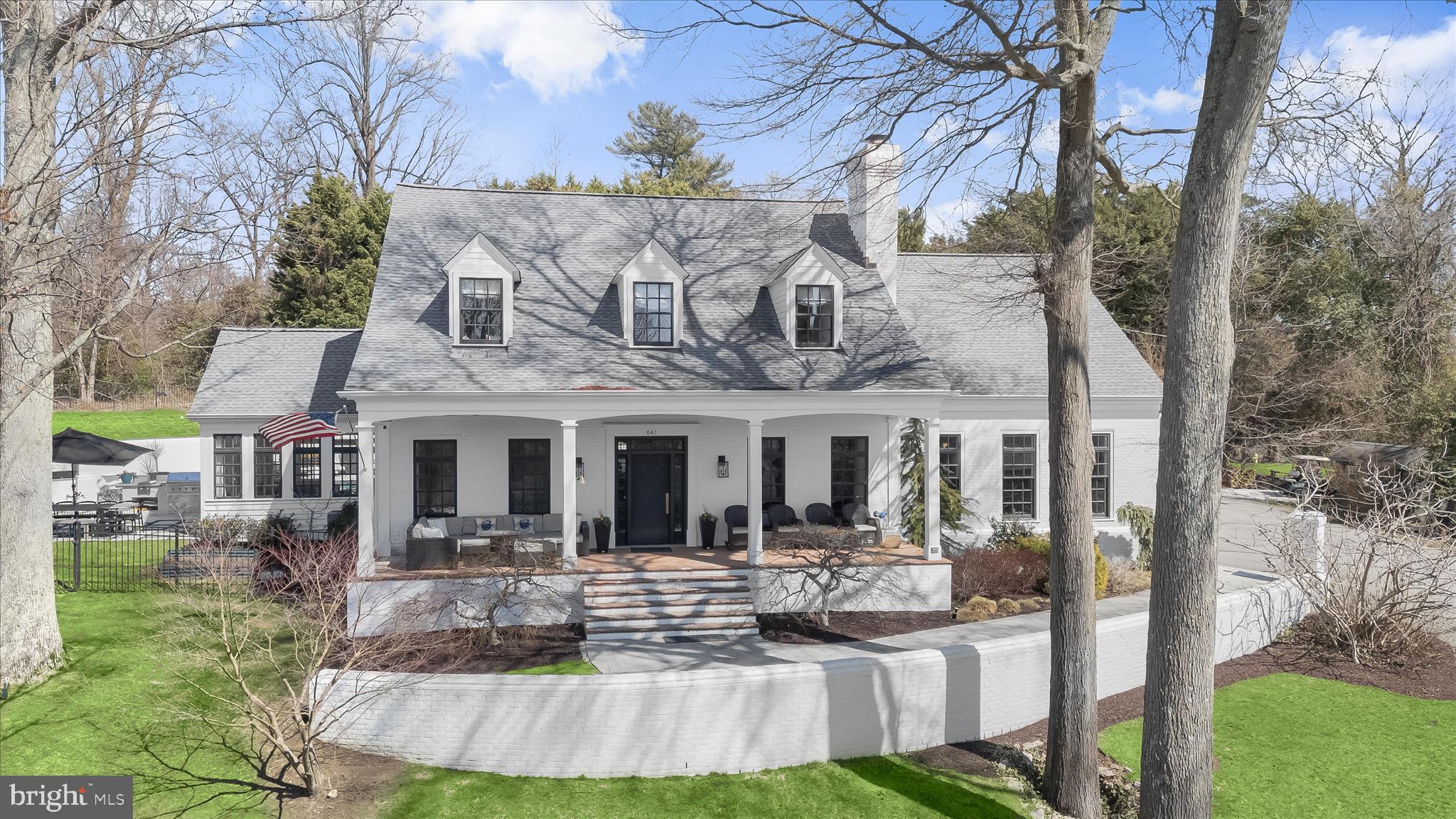 Originally built in 1988 and extensively renovated and lovingly reimagined by the current owner over the past 15 years, this extraordinary, white-painted brick residence blends timeless Southern architecture with thoughtfully curated contemporary design. Spanning 5,641 square feet across three levels and set on just over one acre, the home offers rare scale, privacy, and elevated positioning overlooking tranquil Otter Pond.
Graciously sited atop a gentle hill — well above flood concerns and any cars or golf carts on the street below — the home enjoys both commanding presence and peace of mind. Traditional in form and crowned with three matching cupolas, the exterior evokes classic Island architecture, while the interiors unfold with architectural ceiling treatments, refined millwork, custom solid wood doors with new brass hardware, newly refinished wood floors, curated finishes, and modern systems designed for today’s living.
Seller will consider back-up offers, so property is continuing to be This beautifully designed house is turnkey and ready for a new owner with a clean white brick façade, black-framed windows, and a white brick retaining wall that establishes strong curb appeal. As the driveway ascends, the columned front porch stretches across the façade — an inviting perch for morning coffee or sunset views over the lake.
Designed for exceptional outdoor living, the private rear terrace unfolds into a beautifully integrated heated pool and spa retreat. The freeform pool with adjoining hot tub was completely refinished and renovated with all new piping, systems and equipment in 2022 and is surrounded by expansive Afyon cloud marble hardscaping and crisp white brick walls, creating a secluded, resort-like setting framed by mature trees and lush landscaping.  The pool and hot tub equipment, heater, cleaner and lights are all Wi-Fi/App controlled.  
A newly built Afyon cloud marble patio with grass dividers and fully equipped outdoor kitchen connects the pool area to the sunroom and elevates the outdoor living, featuring a built-in Coyote gas grill and dual cooktop burner, under-counter refrigerator, generous prep space—perfect for classic Maryland crab feasts and effortless summer entertaining. Whether hosting large gatherings or enjoying quiet evenings poolside, the layout offers seamless flow between dining, lounging, and cooking areas. Refined and relaxed, this outdoor sanctuary embodies the very best of Gibson Island living. 
Ample parking at the top of the drive and an oversized two-car garage offer exceptional functionality.
Information on Gibson Island:
Gibson Island is a private island within one hour of Washington, D.C. and Baltimore offering an absolutely extraordinary setting.  The Island comprises 1000 acres with seven miles of shoreline. Two thirds of the Island is undeveloped and is owned by the Gibson Island Corporation, the homeowners' association.  The remaining third is residential home sites. 
Gibson Island is located on the western shore of Maryland, so there is no need to cross the Bay Bridge. On the Island is a 43-acre spring fed freshwater lake in which one may enjoy non-motorized watercraft activities such as paddleboarding, canoeing, kayaking, fishing and swimming.  
The Island offers enormous privacy and security--there is an entry gatehouse staffed 24+Hours, and the Island is patrolled by the Gibson Island Police Force (GIPD).  The Gibson Island Corporation Service Department offers yard maintenance and landscaping and other services for homeowners.  There is a full-service yacht yard.   From the Island, it is just a 20-minute drive to BWI Airport and the neighboring Amtrak train station.  
The Island houses a private country club (membership by invitation) offering yachting, fine dining year-round, tennis, an award-winning Charles Blair Macdonald designed 9-hole golf course, swimming, croquet, skeet shooting, and more.  (C)