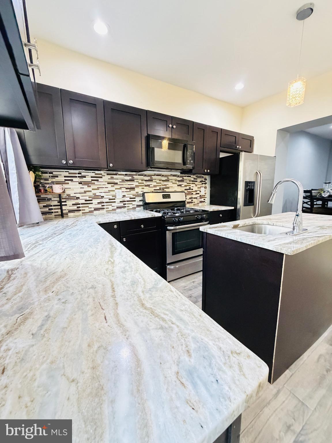 Welcome to this beautifully renovated 3-bedroom, 1.5-bath home, which blends modern comfort and style in a prime location. Recent renovations have enhanced its appeal and functionality. The open layout seamlessly connects the living, dining, and kitchen areas, making it ideal for entertaining. The kitchen stands out with granite countertops, a large island, and wood cabinets. Newly installed central air conditioning ensures year-round comfort. Experience outdoor living with an inviting patio for entertaining or dining and a second-floor terrace for relaxation. The home features three spacious bedrooms and 1.5 stylish baths. Its prime location offers easy access to amenities, shopping, and dining. This exceptional property offers great value and is ready for you to make it your new home! Schedule a viewing today!