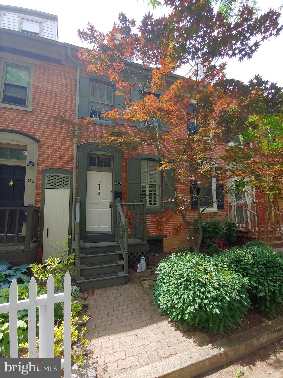 Unique and inviting opportunity in the hip and upcoming Newton Square District! Perfect for that single person or couple wanting to be in the city with private parking and walking distance to downtown venues. This brick colonial style townhome is tucked away in its own private neighborhood. Walk up the newly painted front porch and step onto the custom landing inside the door where you will lavish in the open floor plan consisting of wooden cathedral ceilings and a wall of beautifully exposed bricks in the sunken living room with original hardwood floors. Cross the living room and step up into the custom designed kitchen with freshly painted ceiling and industrial staircase. Beyond the kitchen is a space you can make into your eating area, sunroom, den or office which leads to the newly painted back deck and fenced in backyard. Venture upstairs and find the large master bedroom with walk in closet and hardwood floors and a large bathroom with a step in tub. Continue to the 3rd floor and you'll find a bonus room with skylight.  This could be used as another bedroom, exercise room, office or storage. Don't miss your chance to own a little piece of paradise in York City. Great investment opportunity too!