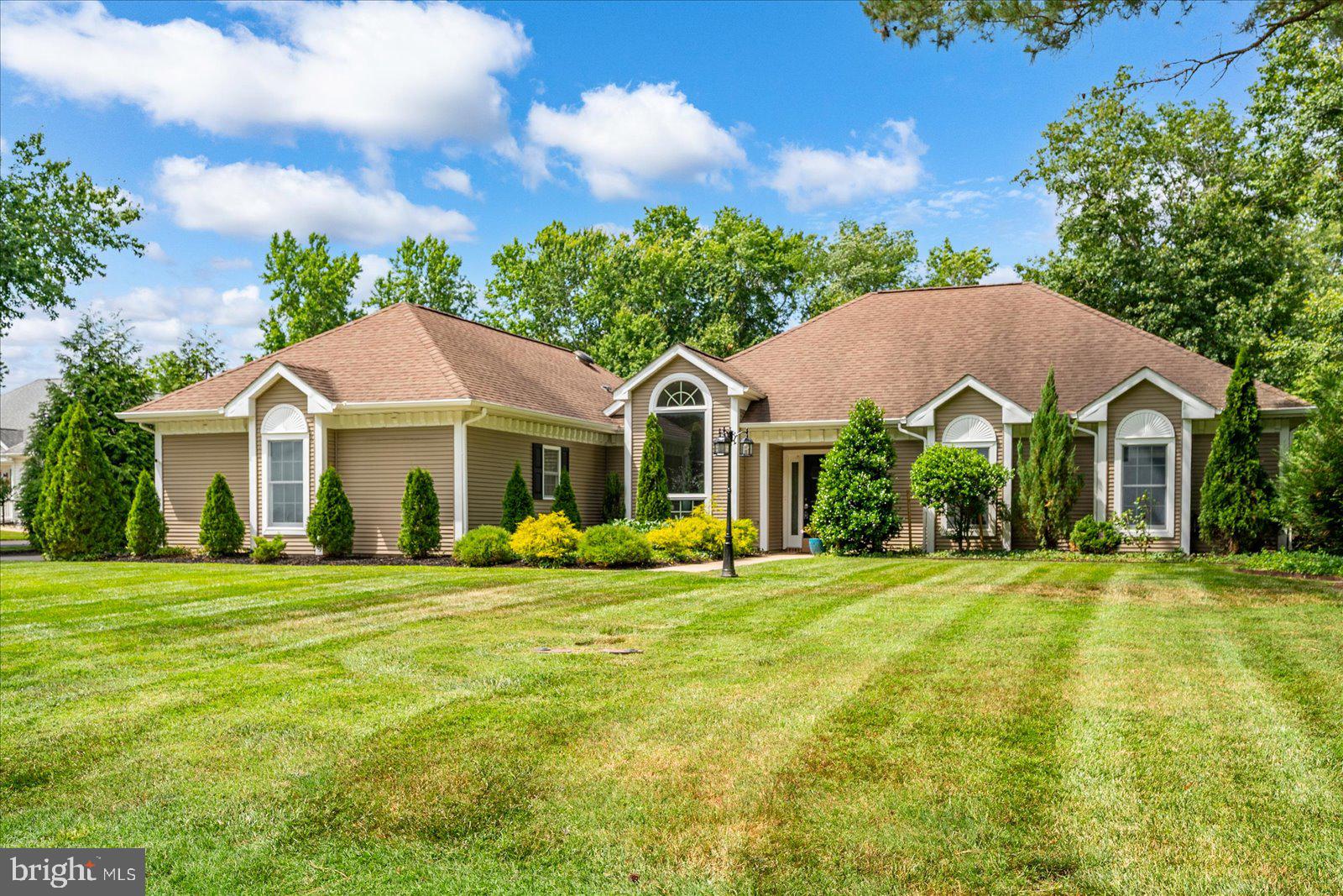 Welcome to your private retreat in the sought-after Mill Pond community of Selbyville. This beautifully maintained 3-bedroom, 2.5-bath home offers the perfect blend of comfort, style, and convenience, just minutes from the beaches, restaurants, shopping, and entertainment of the Delaware and Maryland coast.
Designed for both everyday living and entertaining, this spacious home features a vaulted-ceiling open floor plan, custom hardwood flooring throughout, and a cozy LCD heating built-in fireplace. The updated kitchen is a standout, complete with quartz countertops, a built-in double oven, electric cooktop, and modern appliances. Step outside to discover one of the property's most impressive features—a truly private backyard oasis. Significant investment has been made in mature privacy landscaping, creating a rare garden-home setting with exceptional seclusion. Enjoy outdoor living on the expansive 1,700-square-foot hardscape patio featuring a custom-built drainage system, outdoor lighting, and a stunning 16' x 22' redwood pergola-covered patio area perfect for relaxing or entertaining. Additional upgrades include a newer air conditioning system (installed just two years ago), a full interior repaint in 2022, and upgraded blown-in attic insulation for improved energy efficiency and year-round comfort. Offering privacy, quality upgrades, and an unbeatable location near the beach, this Mill Pond home is a rare opportunity to enjoy coastal living at its finest.