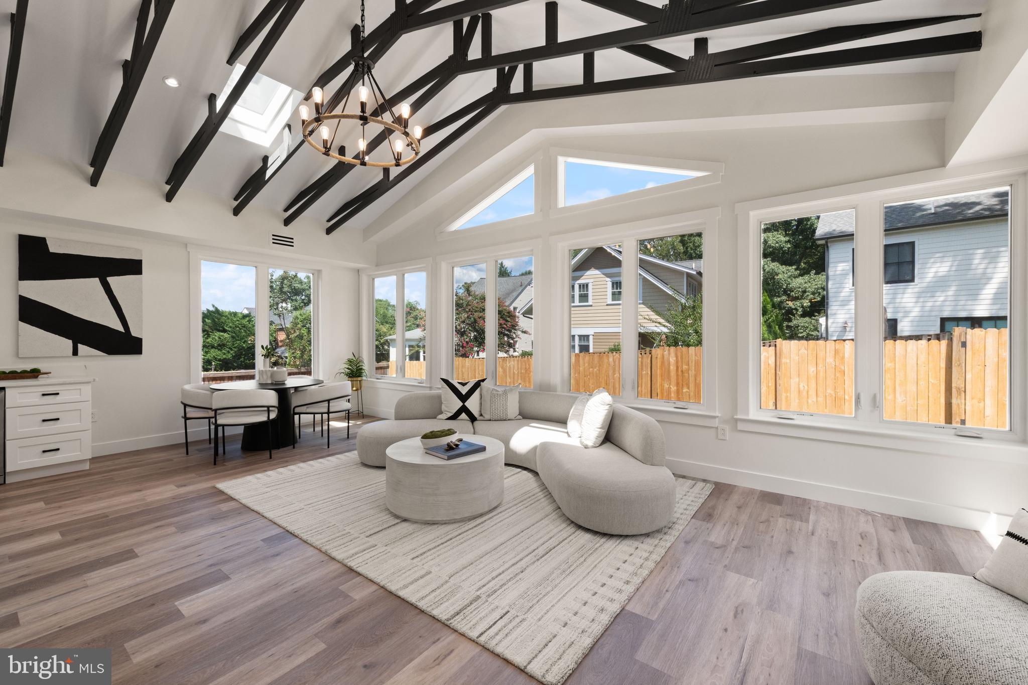Welcome to 4911 Bayard Blvd, beautifully crafted residence in one of Maryland’s most desirable neighborhoods. The main level showcases nine-foot ceilings and a well-designed layout with a spacious living area, a formal dining space, a stunning kitchen with abundant cabinetry, generous preparation space, and top-of-the-line stainless steel appliances. A beautifully designed wet bar with a wine cooler adds a touch of sophistication, making this level ideal for entertaining. Vaulted ceilings and skylights bathe the home in natural light, creating an open and inviting atmosphere. A versatile office or bedroom with its own private side entrance offers comfort and privacy for guests or a dedicated work-from-home retreat. The second level also features nine-foot ceilings and includes two generously sized bedrooms, a full bathroom, and a luxurious primary suite. The suite offers a dream walk-in closet and a spa-inspired bath with a soaking tub, double vanities, and a large glass shower. The third level is entirely dedicated to a second owner’s suite with expansive walk-in closets, a private bath, and stunning views. This level provides flexibility for an additional lounge, family room, or office, making it the ultimate retreat. Outside, the home provides ample parking for multiple vehicles and a private outdoor space perfect for grilling and gatherings. It is also pre-wired for electric vehicle charging, bringing modern convenience to your doorstep. Located less than a mile from Friendship Heights Metro, this residence places you moments from fine dining, luxury shopping, and the very best of Bethesda and D.C. living.