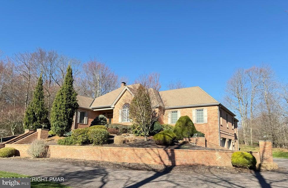One-of-a-kind, must-see brick home offering approximately 3,500 sq. ft. of living space, perfectly situated on the 17th hole of the Split Rock Golf Course in the highly desirable Split Rock community. This impressive residence features 4 bedrooms, 3.5 baths, a 2-car built-in garage, and a paved driveway, all set on a private .92-acre lot. Step inside to a spacious living area accented by a stone propane fireplace, ideal for relaxing or entertaining. The expansive modern kitchen boasts granite countertops, tile backsplash, double ovens, and abundant cabinetry, making it a dream for any home chef. A large formal dining room provides the perfect setting for holiday meals and family gatherings. The well-appointed family room includes a pool table and wet bar, creating an inviting space for entertaining. The oversized primary bedroom suite offers a private retreat with a luxurious tiled shower, soaking tub, and dual vanities. A bright and modern sitting room overlooks the spacious slate patio, showcasing stunning views of the 17th fairway of Split Rock Golf Course. Additionally, the home features a 3,000+ sq. ft. unfinished basement with a brick fireplace, offering endless potential for additional living space. A truly exceptional property in a premier golf course setting. Call today to schedule your personalized showing.