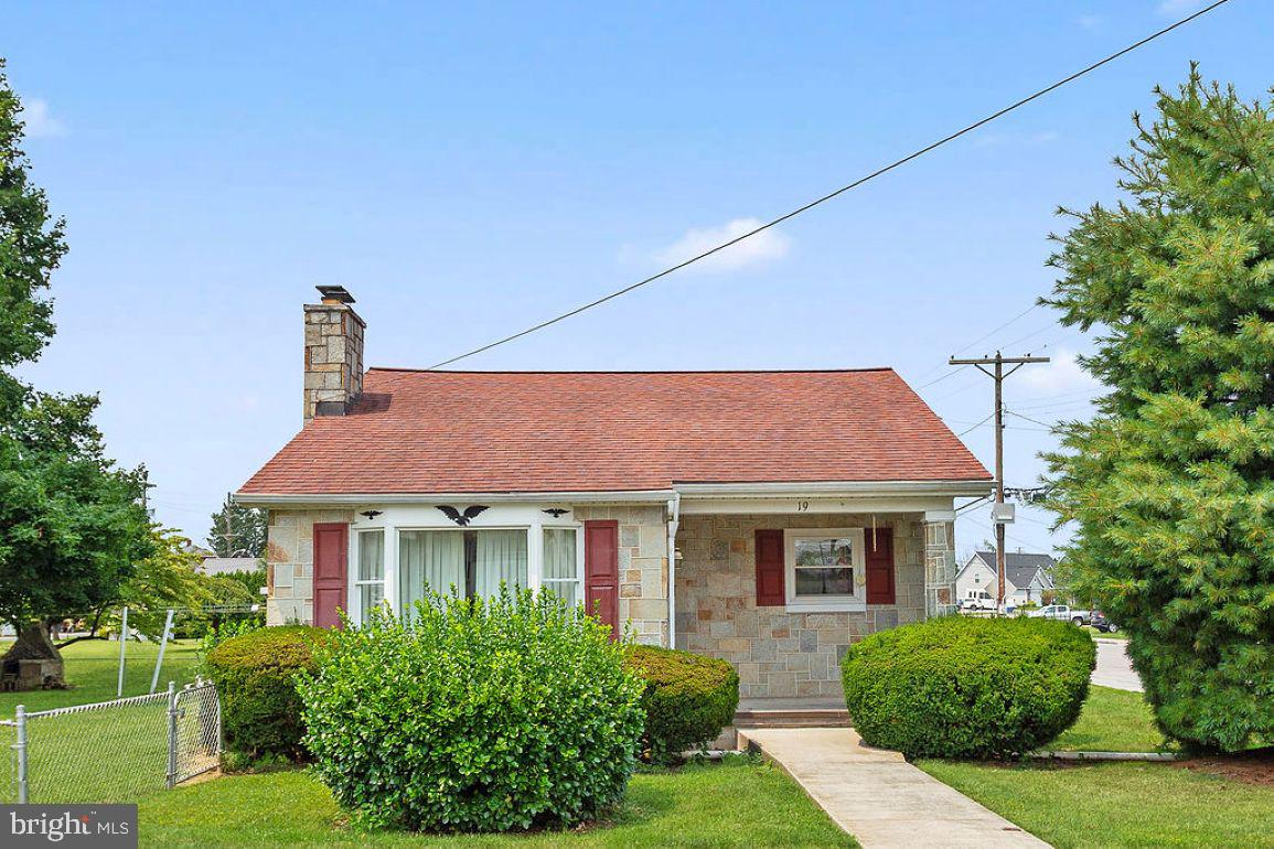 Adorable stone cape cod on a large corner lot fully fenced in.  This solid home is just waiting for the lucky buyers to put their own personal touches on it and bring it up to date.  Unique side entry into the living room with stone fireplace.  The kitchen has so many possibilities and is cute as a button.  The formal dining room can easily fit a nice sized table.   The family room has cathedral ceilings, and a woodstove ready to keep you warm on those upcoming chilly evenings.  The bedrooms, up and down, have the original solid hardwood floors.  The basement has plenty of room to finish off for added living space, and the storage room is an added plus.  Outside there is a covered patio and a huge level back yard which is fully fenced in.  1 car attached garage and the shed stays.  Hurry and make this home your own,