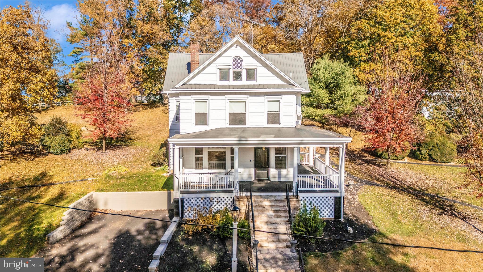 WOW WOW WOW!!! HUGE PRICE IMPROVEMENT! 
 
Welcome to 2027 Lincoln Way East, a charming victorian farmhouse dating back to 1903. This home is nestled on over 5 acres with 5 bedrooms and 4 bathrooms, featuring a main farmhouse, an apartment, barn, stable, and beautiful fenced in pastures. Horses allowed! This piece of history is extraordinary as the owners of this home owned and operated Sunnyside Antiques for over 50 years. Driving up the gorgeous tree lined driveway accompanied with stone piers you’ll  see the victorian main house that features 3 bedrooms and 2 full bathrooms and a stunning fireplace that goes the whole way to the basement. Luxury vinyl plank flooring has been updated throughout, newer windows and a large wrap around porch to enjoy the mountain views! The apartment in located in the back of the second and third floor featuring 2 bedrooms and 2 bathrooms with 2 doors separating the apartment from the main house. The barn has been home to Sunnyside Antiques for over 50 years with original features and comes equipped with propane wall units and central air as well as  recent updated siding and a new roof! Bring your livestock! The shed and stables provide ample space for all your needs! This one is truly a unique find; beaming with history and beauty! Don’t miss it!
