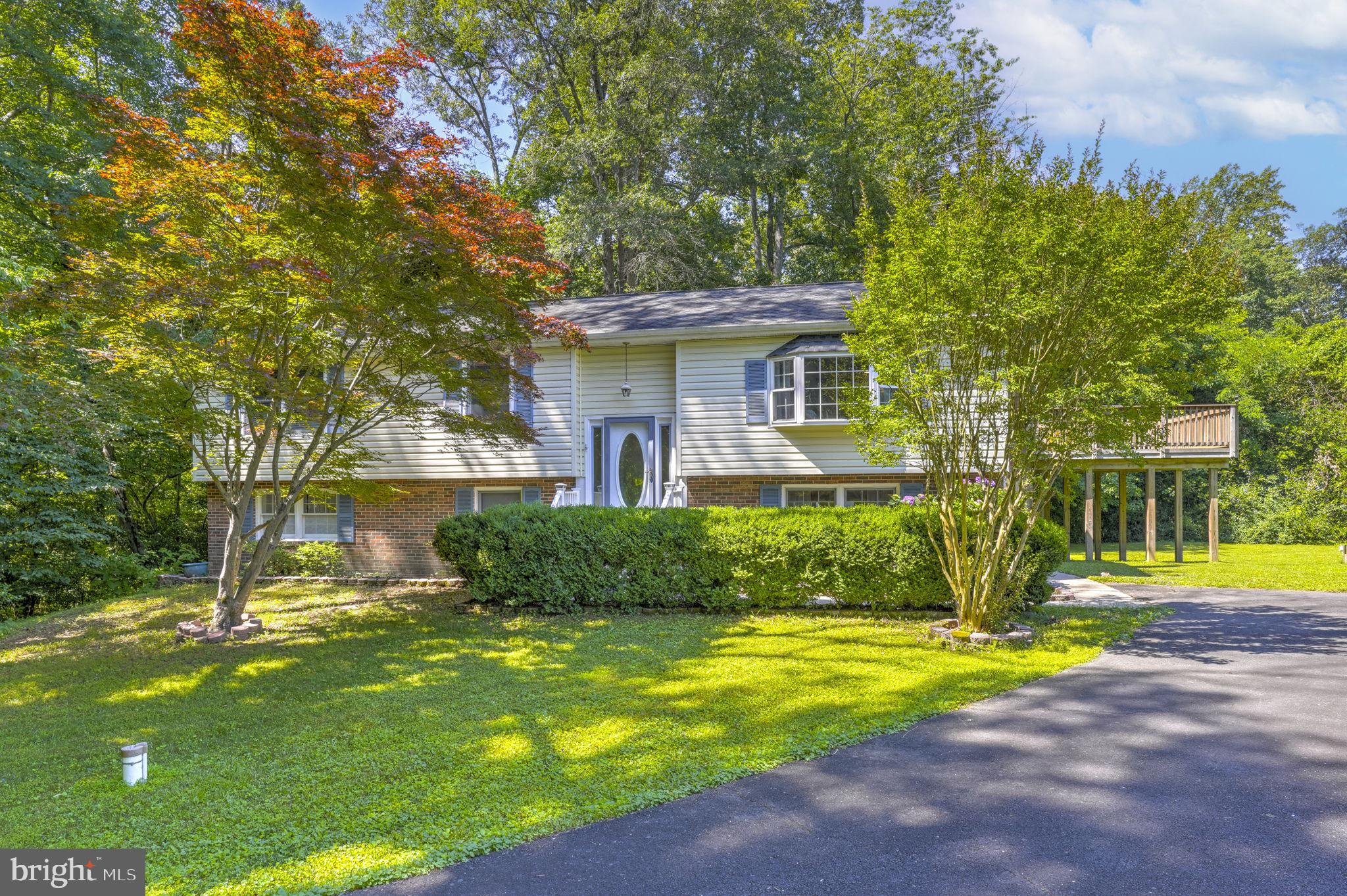 You won't want to miss this rare opportunity in Regal Estates. Tucked at the end of a long private driveway, this spacious 5-bedroom, 3 full bath home sits well off the cul-de-sac on over an acre that backs to trees.

Inside, an open floor plan features hardwood floors, exposed wood beams, a brick fireplace, and an updated kitchen with a large island (with teak countertop) and new appliances.

If you enjoy peaceful mornings and evenings watching the birds, deer, and sunsets, you'll love the large deck and screened-in porch with a vaulted wood-beam ceiling. Out back, you'll also find a patio, a shed with electricity, and a dedicated plug for an above-ground pool.

Smart upgrades round it out, including a new hybrid hot water heater that qualifies for the SMECO rebate and a UV light sanitizer on the well system.

Conveniently located close to shopping and just minutes from Dunkirk District Park and Ward Farm Recreation and Nature Park. Commuters will love the quick access to Route 4 and the Dunkirk Park and Ride, less than 3 miles away, with commuter bus service to Washington, D.C. and the Navy Yard. The home is also within an easy commute of PAX River Naval Air Station and the Calvert Cliffs Clean Energy Center in Lusby, and close to the public boardwalk and shops of North Beach. No HOA.