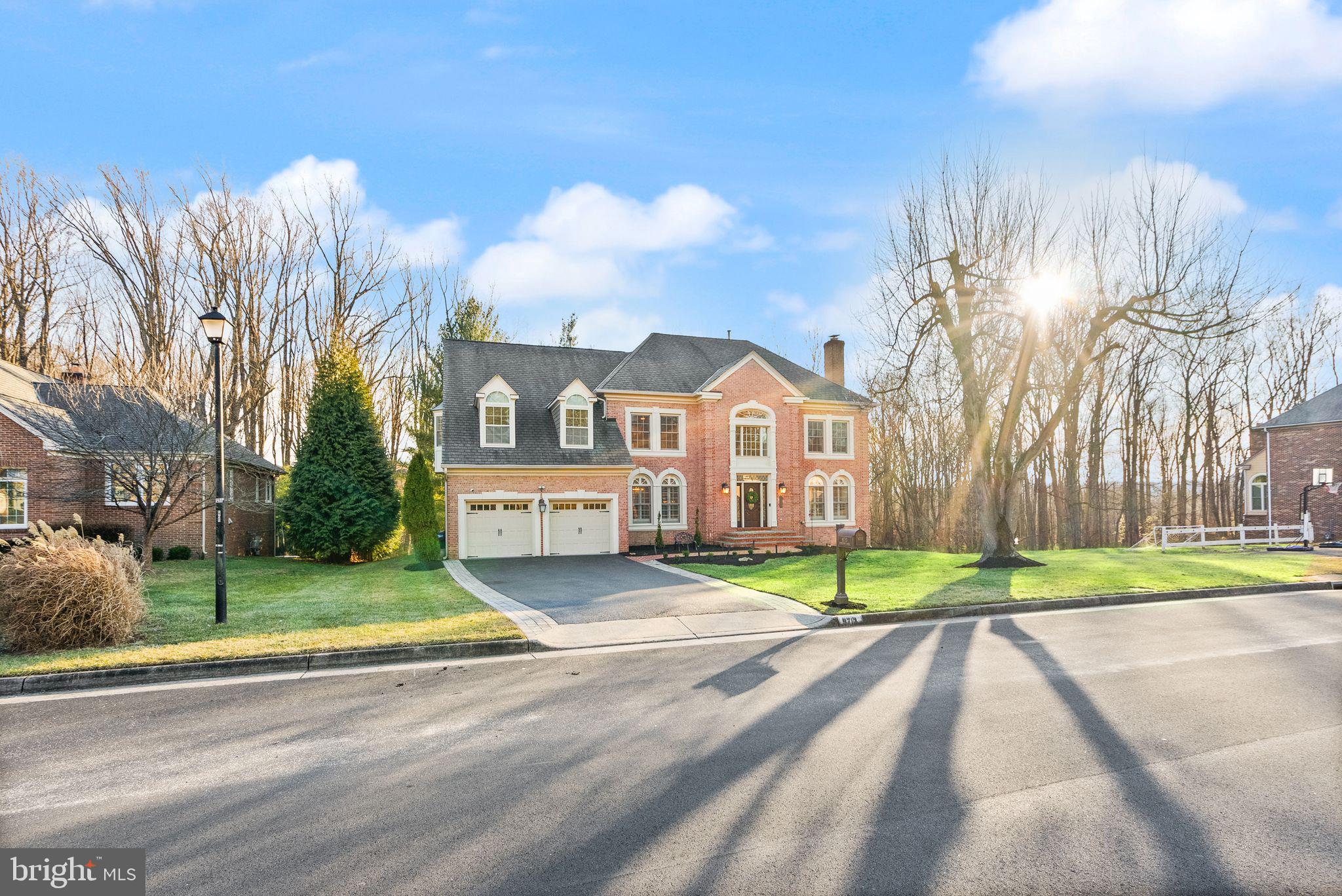 ** ALL OFFERS DUE BY SUNDAY, FEBRUARY 16th By 6 PM ** LUXURIOUS HOME IN VIENNA! Nestled in the prestigious Middleton neighborhood of Vienna, this beautifully renovated home with over 6000 square feet of distinctive living space is within the highly-ranked Cooper/Langley school pyramid. Set on a premium 1/2-acre lot, the property is surrounded by nature and offers breathtaking views of adjacent open forest, providing an idyllic setting for both relaxation and entertaining! ** From the moment you step into the grand foyer with its sweeping curved staircase and gleaming hardwood floors, this home exudes timeless elegance. The all-brick and HardiPlank construction, combined with high-end upgrades, creates a perfect blend of beauty and durability. The spacious living and dining rooms provide ideal spaces for hosting guests, while the chef's gourmet kitchen is a true standout, featuring top-tier appliances, a 9.5-foot island, a 180-bottle wine fridge, and exquisite cabinetry. Additional highlights include a large walk-in pantry, a convenient laundry room, and a 2-car garage with an upgraded storage system. At the heart of the home is the great room, boasting a stunning stone gas fireplace, skylights, and panoramic views of nature. A private main-level office with French doors leads to the elegant living room, which features a second fireplace. Throughout the home, you'll find neutral decor, handsome crown molding, and hardwood floors on all three levels.

Upstairs, the luxurious owner’s suite offers vaulted ceilings, a private sitting room, and an extraordinary custom-designed walk-in closet. The spa-like updated bath features granite countertops, a double vanity, a Jacuzzi tub, and a separate shower. Three spacious secondary bedrooms, including an ensuite bedroom with a private bath, plus a shared bath for the remaining two bedrooms, complete the upper level. The walk-out lower level is designed for entertaining, featuring a spacious recreation room, a game area, a newly installed wet bar (2022) with exotic countertops, and a fully updated bath. A bonus room and a large storage area add convenience and flexibility. Step outside to enjoy every season on the expansive composite deck, offering incredible views of nature, trees, and wildlife. The private, leveled backyard serves as a serene oasis, perfect for relaxation or entertaining.

This exceptional home combines luxury, comfort, and style, providing an unparalleled living experience. Located in a beautiful community, this home is just moments away from Vienna's charming commercial district, parks, shopping, dining, Tysons Corner, Reston, Meadowlark Botanical Garden, Wolf Trap, Great Falls National Park, Lake Fairfax, and Roer's Zoofari. With easy access to the Silver Line Metro, Rt. 7, Dulles Toll Rd, and Georgetown Pike, convenience is at your doorstep. Don’t miss out on this absolute showstopper!