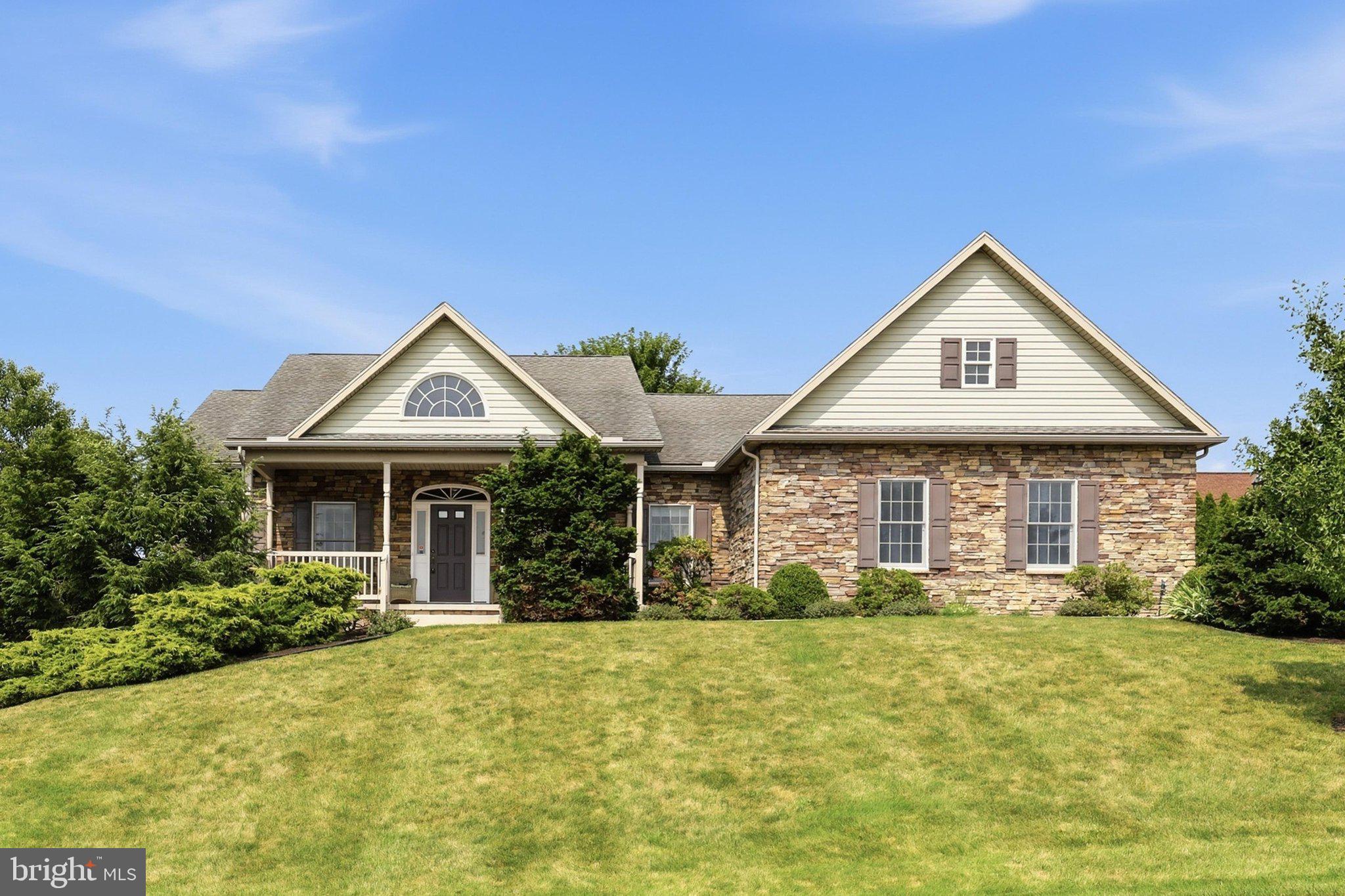Lovely one owner home in the Penn National golf course community.  Built by Bryan Hey in 2006, this 2,300+ 3 bedroom, 3.5 bath home includes features like: hardwood floors in the main living area, built in cabinets in the great room, gas fireplace, composite deck with awning, finished space in the basement including a full bath, upgraded kitchen with pull outs, gas range, double oven, and granite counters, large primary suite with extra closet space, walk in shower, double vanity, informal and formal dining, and golf course views! New(July '26) heat pump A/C to complement the gas forced air heat. Large storage space with shelves in the side walk out basement.