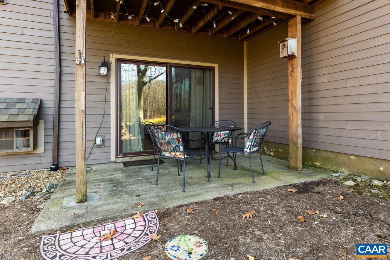 Enjoy Wintergreen from this fully furnished condominium on the 18th Fairway of Devils Knob.  Walk to the clubhouse, spa, Nature Center, restaurants, tennis, pickleball and everything else close at hand.  The Ski shuttle stop us just outside your door during ski season.  Tastefully furnished for the Wintergreen Rental Program and ready for your use immediately. This is a wonderful opportunity to have a luxury villa at Wintergreen without a huge cost.  Fairway Woods Condo Association is $1625/quarter and provides insurance, snow removal, trash depository, chimney sweep, and outside maintenance with professional management.