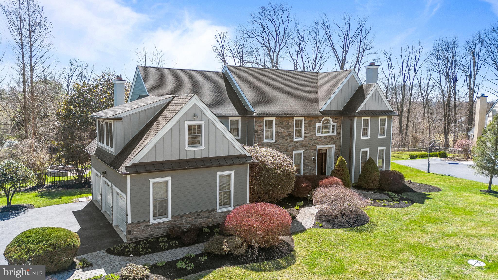 Elegant estate living on a private cul-de-sac in the highly desirable Springton Reserve community of Newtown Square.  Welcome to 4 Greystone Circle, an exceptional estate home offering the perfect blend of elegant design, expansive living spaces, and a peaceful, private setting. Situated on nearly an acre of level property, this impressive residence features six bedrooms, five full baths, and two half baths. A rare first-floor bedroom suite with a full bath and walk-in closet provides exceptional flexibility for multigenerational living, extended guests, or an au-pair suite.

Step inside to a dramatic two-story foyer filled with natural light, beautiful hardwood flooring, and custom millwork, setting the tone for the elegant yet comfortable living spaces throughout the home. The formal living and dining rooms provide inviting spaces for both everyday living and entertaining. The living room features a gas fireplace and direct access to the private first-floor bedroom suite, offering both convenience and privacy for guests or multigenerational living.

At the center of the home is the bright and spacious eat-in gourmet kitchen, thoughtfully designed for gathering and entertaining. Featuring granite countertops, a center island, double oven, stainless steel appliances and abundant cabinetry, the kitchen offers both style and functionality. The space flows seamlessly into the impressive family room with vaulted ceilings and a stone surround gas fireplace, creating a warm and inviting setting for everyday living. Sliding glass doors open to a spacious deck overlooking a private backyard and expansive, fenced, level lot—complete with an outdoor fire pit and basketball hoop—creating the perfect setting for seamless indoor-outdoor entertaining. Completing the main level are a laundry room, powder room, and oversized three-car garage.

Upstairs, the primary suite offers a true retreat, featuring a spacious spa-like bath and an expansive walk-in closet. Four additional bedrooms complete the second level, including two with private ensuite baths and walk-in closets. The remaining two bedrooms share a well-appointed Jack-and-Jill bathroom, offering both comfort and convenience.

The finished lower level offers exceptional additional living and entertaining space, featuring a dedicated movie theater room, game room, and expansive recreation area perfect for gatherings. This level also includes a kitchenette, half bath, two storage rooms, and interior access to the garage, creating a flexible space ideal for entertaining, hobbies, or relaxing with family and friends. 

The entire exterior was completely renovated in 2020 and upgraded with James Hardie siding and trim, offering timeless curb appeal along with the added benefit of a transferable warranty. Recent updates include fresh interior paint throughout the home, an updated HVAC system, and a newer hot water heater. The home is also equipped with a whole-house generator, new electrical subpanel, and whole-home surge protector, providing added comfort and peace of mind. Enjoy the added benefit of no HOA fees and no local income tax.

Ideally located just minutes from the Shoppes at Ellis Preserve—featuring Whole Foods, Ruth’s Chris Steak House, Sedona Taphouse, La Colombe, and other popular dining and shopping destinations—this exceptional home is also close to downtown Media, Ridley Creek State Park, and Rose Tree Park. Residents enjoy convenient access to major routes for commuting to Philadelphia, the Main Line, and New York City, as well as nearby country clubs and golf courses.  This is a rare opportunity to own a truly turnkey, well maintained  home in one of Newtown Square’s finest communities.