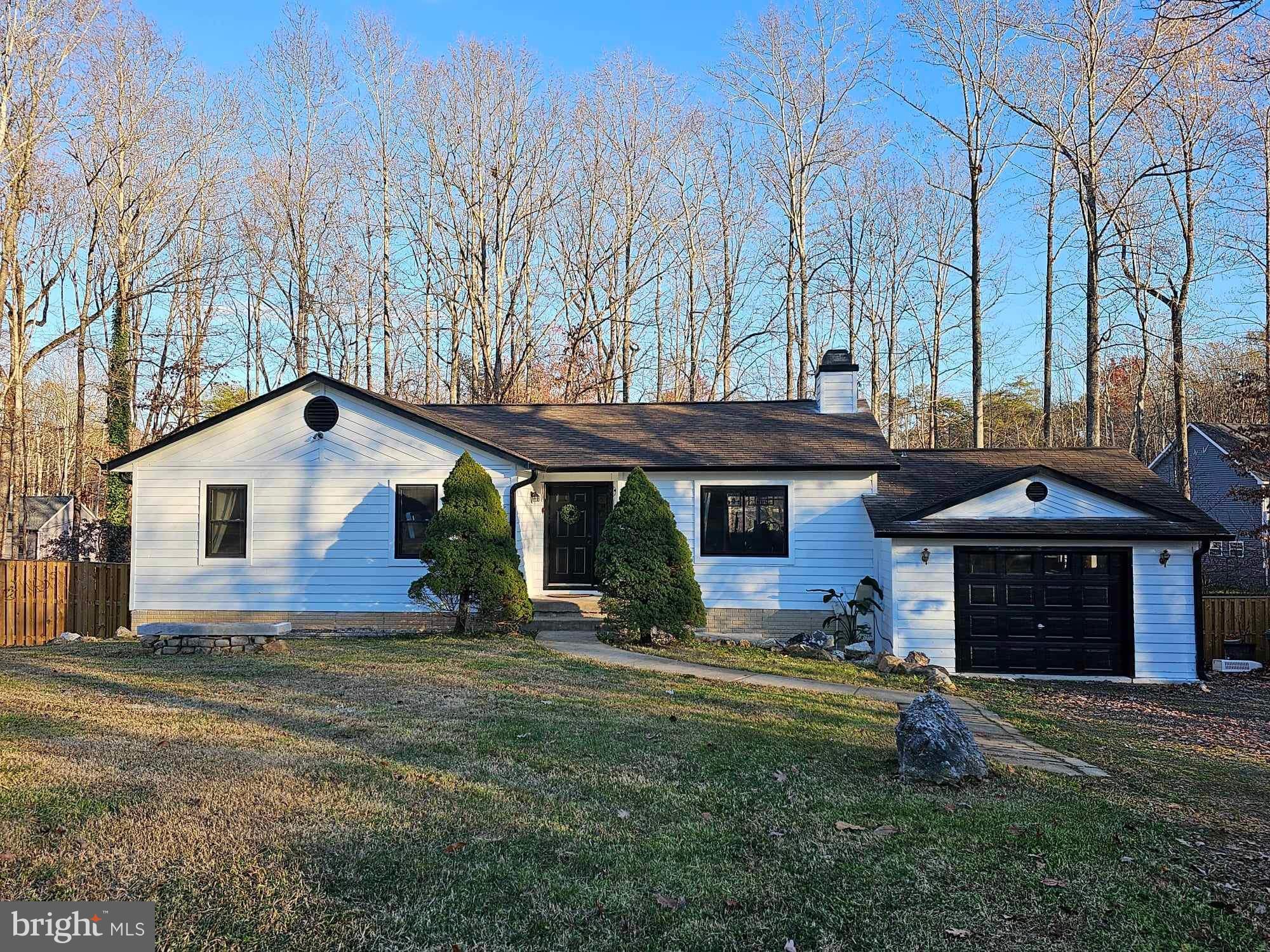 Come see this freshly remodeled farmhouse and fall in love! This beauty has it all: completely remodeled in  2023 to include new windows,  floors,  kitchen, baths,  fence , deck addition, and so much more. Interior features include beautiful laminate flooring throughout, gorgeous shaker cabinets,  stainless steel appliance package  w/  range hood, hand carved butcher block counters, tiled bath/shower with extra deep soaker tub, black finishes on all hardware/light fixtures, custom bar w/ beverage fridge, drop zone w/ shiplap wall & live edge wood shelf,  fresh paint both inside and out. This home is move in ready and sure to stun, sitting on a double lot & almost a full acre of beautiful wooded property.  Sculpted flower beds, mature landscaping & a potting shed make this a yard for all seasons.  Triple tier deck & oversize shed round out this great home.  All this and only 20 mins from Culpeper or Fredericksburg for great dining, shopping and more.    Call today and schedule your showing before this one is gone.
